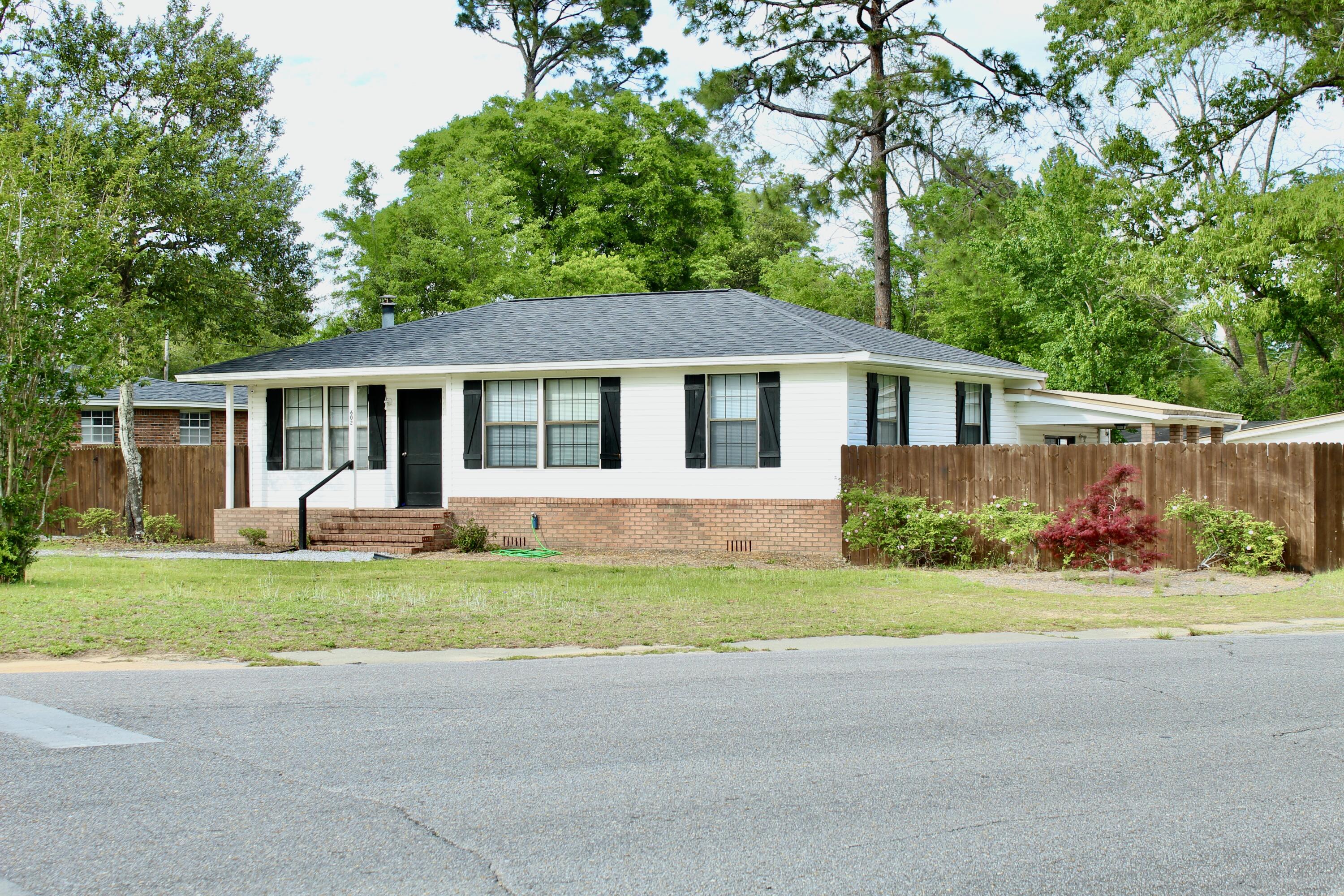 In the center of Crestview we have a home on a corner lot! There is 2 homes on site and the main home is a 3 bd/1 bath home with a large dining area, living space and functional kitchen. The family room is spacious and leads out to the privacy fenced yard with and outbuildings. The home has new carpet, paint, main house has copper wiring and the second home is a newer home and the roof is about 4 years old and AC about 2-3 years old (for the main home). The second home has 2 bd/1 bath and it has been freshly painted and has new carpet. This property is a perfect investment, the 2nd home can be used as a man cave, mother in law suite, etc. Call today and to schedule your appointment!