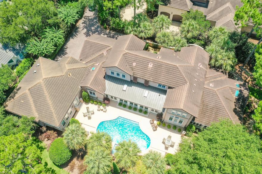 Located on one of the most desirable lots in all of Sandestin, this beautiful legacy home is a rare, one-of-a-kind opportunity to own the flagship property in Island Green. Designed by renowned architect, Tom Christ, this stunning home of over 6,800 sq.ft. capitalizes on 295ft. of lake frontage to create maximum privacy while combining abundant natural light with interior openness. Spectacular views of The Raven Golf Course, including the signature #6 hole, can be seen from almost any room along the north facing side of the home. In 2012 an expansion by Boswell Builders added over 1500 sq. ft., resulting in a magnificent master bedroom/bath suite at the East end of the home. The first floor of this home features oak & mahogany hardwood floors, 10' ceilings, 10'' crown molding,