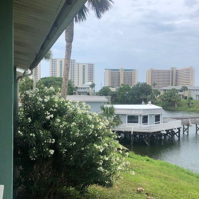 Centrally located in the heart of Destin, 1 Bedroom and 1 Bath Condo on the second floor with a beautiful water view of the lake and a slight view of the Gulf. Great short term and long term rental. Walking distance to beaches, restaurants, shopping and entertainment. Amenities include: 3 pools, tennis courts, outdoor grills, community room, laundry mat and more. Buyer to verify any & all dimensions.