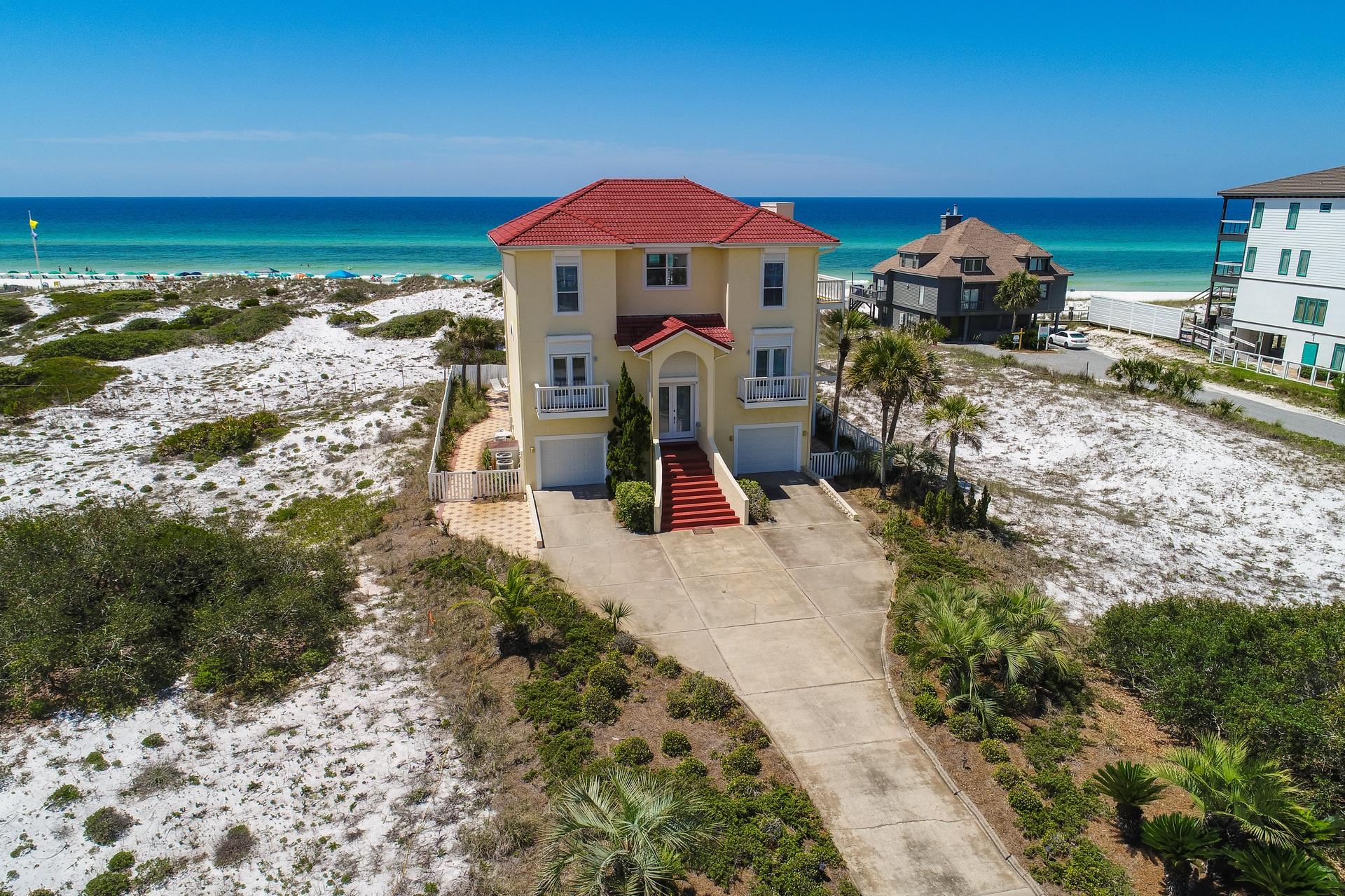 PERPETUAL DIRECT GULF VIEWS WITHOUT GULF FRONT PRICE!! This one tier back gulf view home resides on the solitary unique strip San Roy Road seen from 30A across Eastern Lake. With both a lake and gulf views it would be difficult to beat the location of this home unless buying direct gulf front. A gorgeous protective ancient dune gulf side protecting this home's life-time perpetual direct gulf views! Offering a two car garage, heated pool, ELEVATOR and moments from beach access the home is built for views with windows taking up much of the gulf facing walls. Recently renovated kitchen and baths are new accents and this is a canvass for potential further renovation although not required. Wrap around balconies galore that connect the outdoor space of the master bedroom and living area.