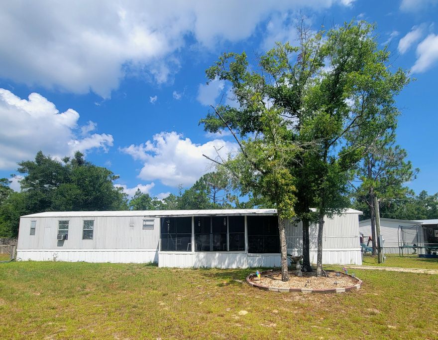This beautiful 3-bed/2-bath home is close to town with a fenced yard and the back yard has a barn. The property has a front porch and a back porch perfect for relaxing and enjoying your morning coffee.  Located approx 40 minutes north of the white sandy beaches, and less than 10 minutes to downtown DeFuniak Springs with boutique shopping, and restaurants.