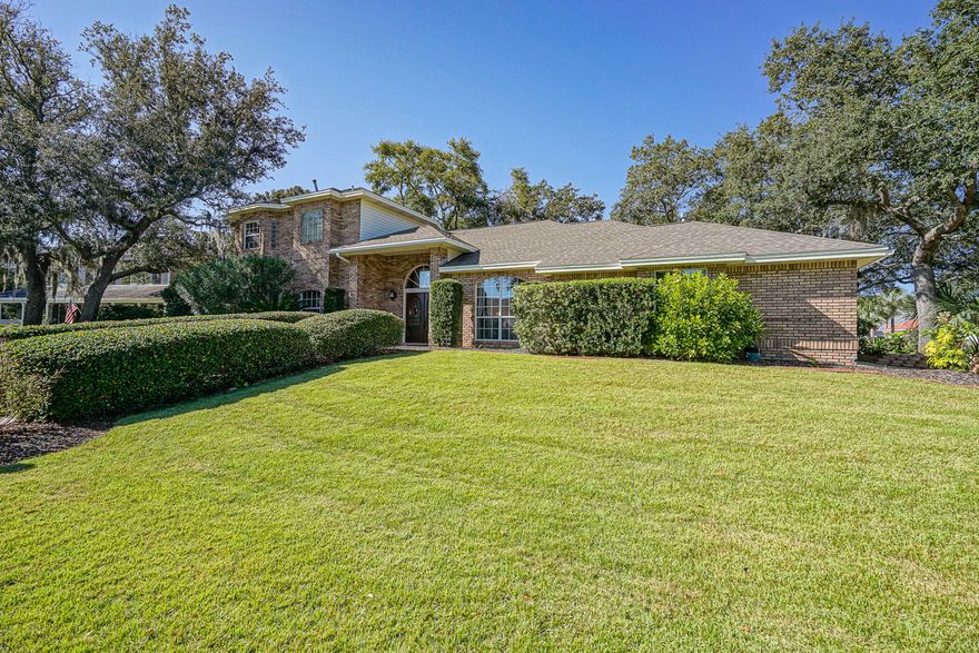 Enjoy bay breezes and a glimpse of Choctawhatchee Bay from this beautiful brick home situated across the street from the water. You'll be impressed the moment you walk through the double entry doors and into the open foyer.  Interesting angles, plant ledges, raised and high volumn ceiling treatments throughout for a very spacious feeling.  Fantastic kitchen, with an abundance of cabinet and counter space, features granite counters, stainless appliances, pantry, breakfast bar and desk area.  Dining options include a formal room and breakfast nook.  Fabulous master suite offers a sitting area, room for workout area, 2 closets, separate shower and jetted garden tub.  If you enjoy the outdoors, you will appreciate the 23x15 screened porch and large open patio. This is a jewel, don't miss out.