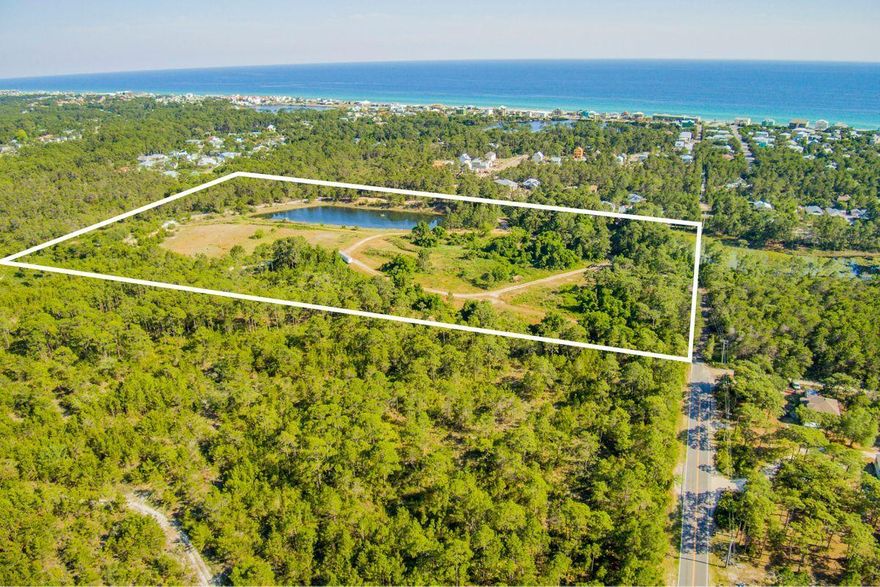 20 ACRES South of Hwy 98 with possible future access to the public beach! Located at the end of Sugar Drive just North of Stinky's Restaurant and Serenity at Dune Allen subdivision. Parcel is zoned small neighborhood with the possibility of 10 units per acre and 10 percent that can be commercial. This parcel is all natural, full of trees and has a .6 acre of a beautiful Cypress Pond that can not be touched, as well as a man made fish pond stocked with fish! Surrounded on 3 sides by State land, it is very secluded. Develop the property or use it as a huge private estate! Buyer is responsible for all due diligence and verifying lot dimensions.