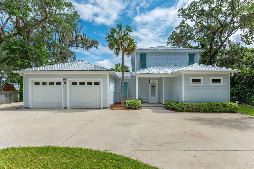 Paradise Found!! It is all here. Beautiful yet relaxing home with all of the anenities for waterfront living. Located on Mallet Bayou and is just feet from the Bay. Home features a welcoming Great Rooom with kitchen, dining and living area overlooking the water. Kitchen features stainless appliances with gas cooktop plus granite island. In the living room area is a gas fireplace for cool evenings. Also on the first floor is 1 of 2 master suites, laundry area and half bath. There is a wooden staircase to the second floor or ride the elevator which opens to the den on the second floor. You will also find a guest bedroom and bath and the second master bedroom. Closets line one wall aas well as 1 walkin closets. Off of this bedroom is a balcony overlooking the bayou. Off of the Screened porch is a 28x15 inground self chlorinating pool enclosed with a concrete deck enclosed by a screenroom. . From the pool area, follow the sidewalk to the dock with 2 boat house with lifts. Water and electricity are at the dock. To the left is a patio with a firepit for evening relaxation. Also included is a 20x48 heacted and cooled garage for a motor home with an attached area for outdoor grilling. There is a separate 12 x 24 storage building. Property has an artesian well used for irrigation. Paved ciricular drive for extra guest parking. Note: home includes 4 HVAC units - 2 for house, 1 for auto garage and 1 for RV garage.