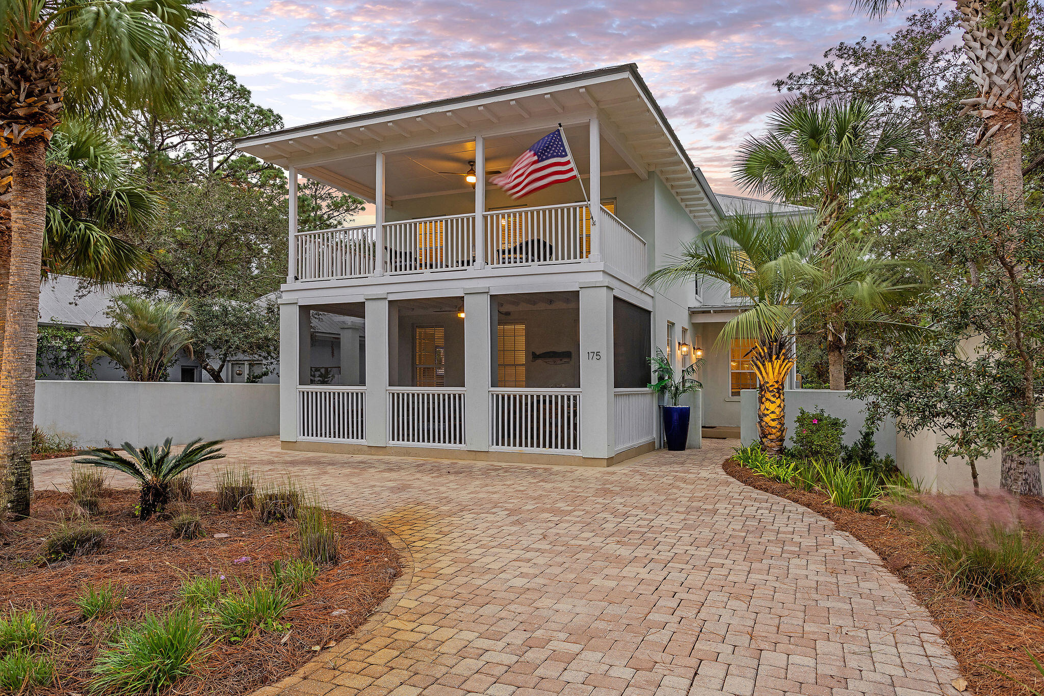 Fortified concrete construction home located just a short stroll from the beach in Seagrove. This custom built design in Gulf Shore Manor has been meticulously maintained by it's current full-time residents. The prime location is just 0.21 miles from the deeded beach access and the sugary white sands of 30A making this home ideal for rental investment, second home, or primary. A perfect blend of indoor and outdoor space is evident in the screened-in lower level porch, backyard with heated saltwater pool, upper level porch, and well designed interior floor plan. The lower level consists of a spacious living room with thoughtfully curated built-in shelving and an exterior door to the screened porch. Flowing from the living area you will find an open concept kitchen and dining area with a