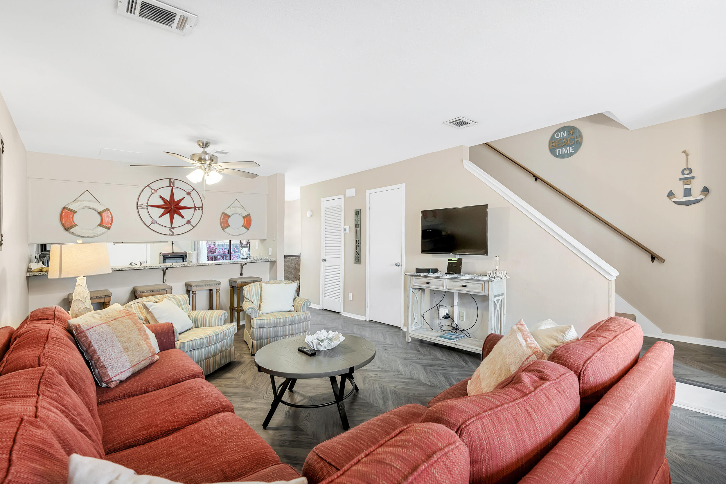 NOW IS YOUR CHANCE TO OWN A PIECE OF PARADISE JUST STEPS FROM THE BEACH UNDER $500K. Sandprints is a low-density condominium tucked away in Miramar Beach with a cozy community pool. This two-story 2 bedr/2.5 ba is an end unit allowing for the extra Florida sunshine. On the first floor is living room, kitchen, dining area and 1/2 bath. From the kitchen you have access to a nice balcony facing the neighborhood. On the second floor are both bedrooms with their own bathrooms and private balconies. The full-size washer and dryer are conveniently located on the same floor. Property is sold FULLY FURNISHED. HVAC was replaced May 2021 and the WATER HEATER Feb 2023. Other features are storm-door, plantation shutters. The assigned parking is right in front of the condo so easy access.