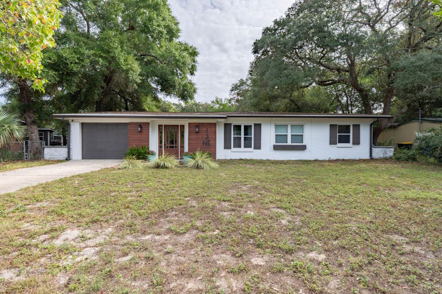 This amazingly unique mid-century home in the highly sought after Elliott Point neighborhood has been remodeled 2021. Beginning with the Brazilian wood that flanks the front door, shiplap walls, tongue & grove ceilings, quartz counters, unique tiled floors, stone fire pit, natural wood beams and great entertaining backyard you don't want to miss this one!  Upon entering the home you will be greeted with a spacious foyer with shiplap walls, exposed brick, original cabinets  & tiled walls. Off the foyer is your master bedroom retreat with a private fireplace & french doors leading out to a covered patio. The brand new master bath has a fabulous tiled floor, double vanities and a large walk in closet. Brand new luxury vinyl planks have been placed in all the main living areas and bedrooms.