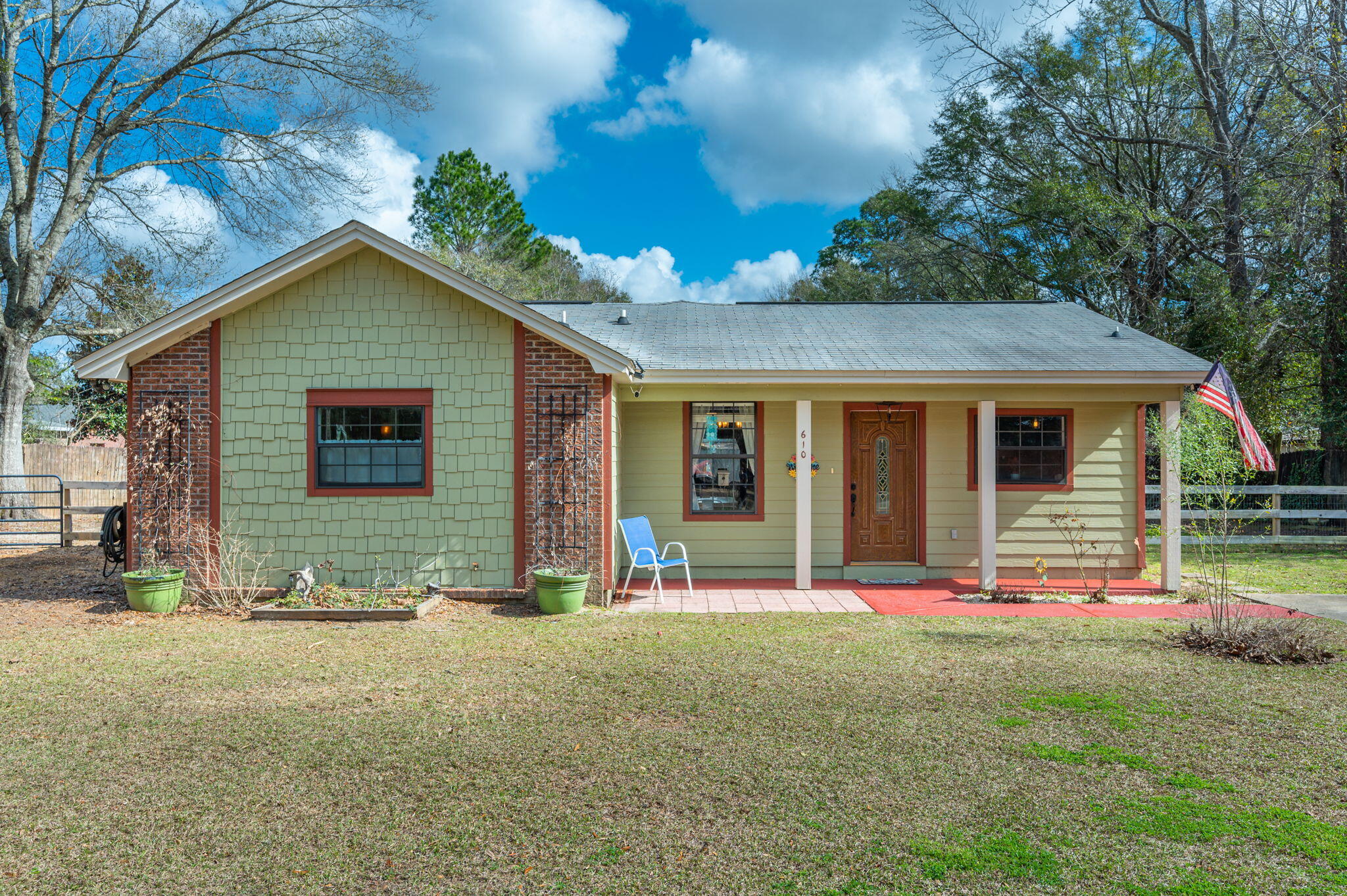 New roof at closing! This home is situated on over a half acre lot & was fully renovated in 2015 to include new wiring and plumbing! Once you head inside your eyes will be drawn to the open floorplan that boasts character and charm throughout. From the metal accented ceilings w/ wooden beams to the kitchen made for entertaining, this home is sure to please. The master suite features a wooden accent wall, expansive closet, and bathroom with tiled walk-in shower and claw foot tub. The remaining bedrooms are generously sized as well. The kitchen offers industrial floating shelves, granite countertops, and stainless steel appliances. Retreat outside and enjoy the covered back porch that offers gorgeous views of the backyard. There is a greenhouse and covered carport for your enjoyment as well