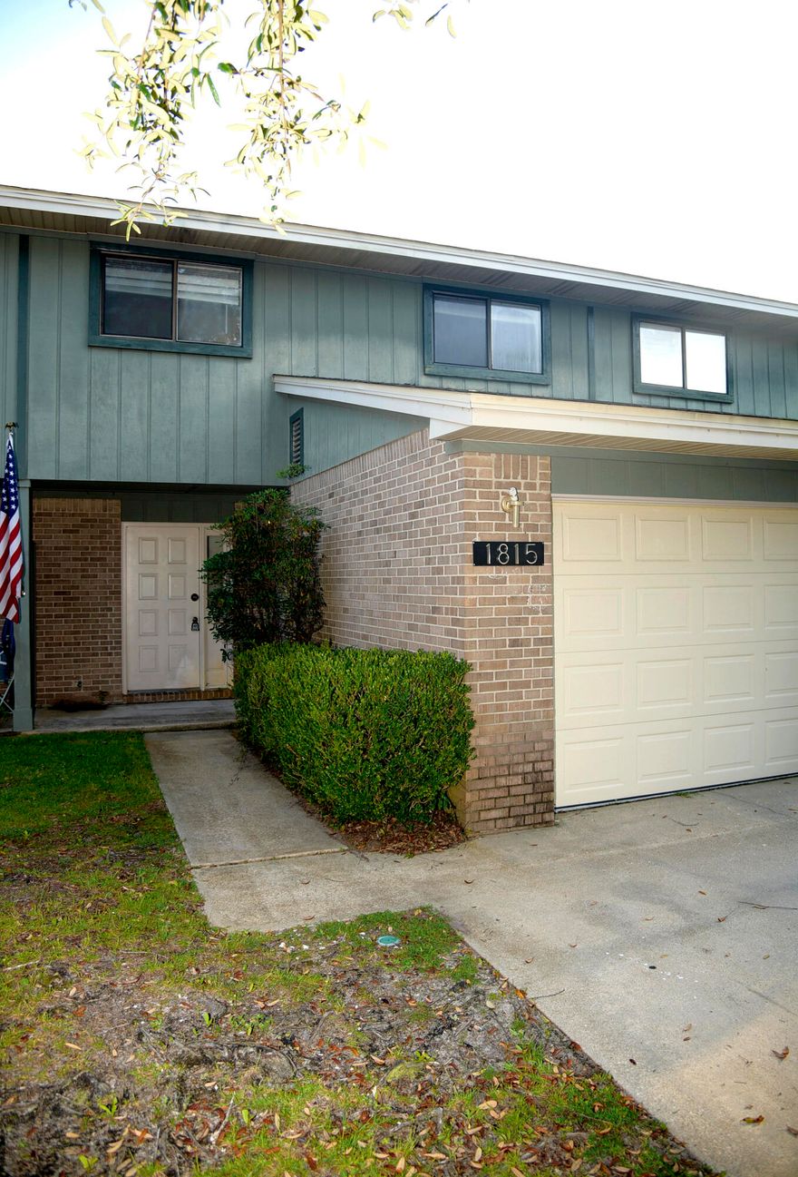 BRING YOUR BOAT!! This unique town home has a  dedicated boat slip on the protected deep water of Rocky Bayou. It's a bright and fresh home with newer carpet, refrigerator and stove. The comfortable floor plan features a great room with corner stone fireplace, dining area, and kitchen. Sliding glass doors lead to the patio, common area and dock. All bedrooms are upstairs  with the master having a bayou ''glimpse'' and a walk-in closet. The dock master assigns the docks based on boat size. They are not deeded to an individual unit.