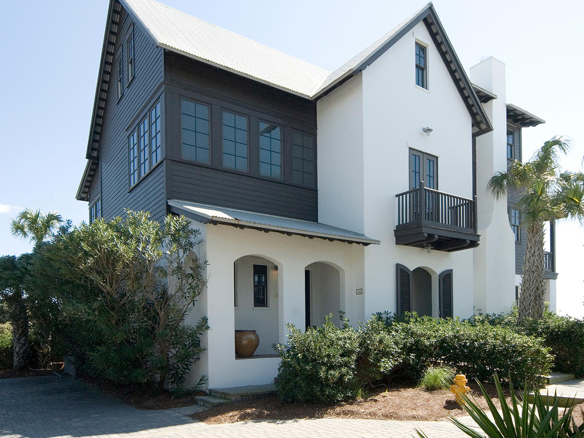 Resting atop the high bluffs of Blue Mountain Beach is this luxurious Gulf-front home, whose design and construction bears the distinctive quality of builder Davis Dunn. It's elegant yet comfortable Nantucket-style decor is being offered with purchase. One among four homes behind the gated walls of Lupine, this home shares a private beach access with its three neighbors and enjoys the protection of a fully-permitted seawall as well as hurricane-rated Pella windows and doors. Nearby Walton County lifeguard service adds still more peace of mind. Each of the five bedrooms offers a private bath and views of the Gulf. A private, covered entrance on the ground floor leads inside to a foyer, off of which are three bedrooms, one being the first of two master suites.