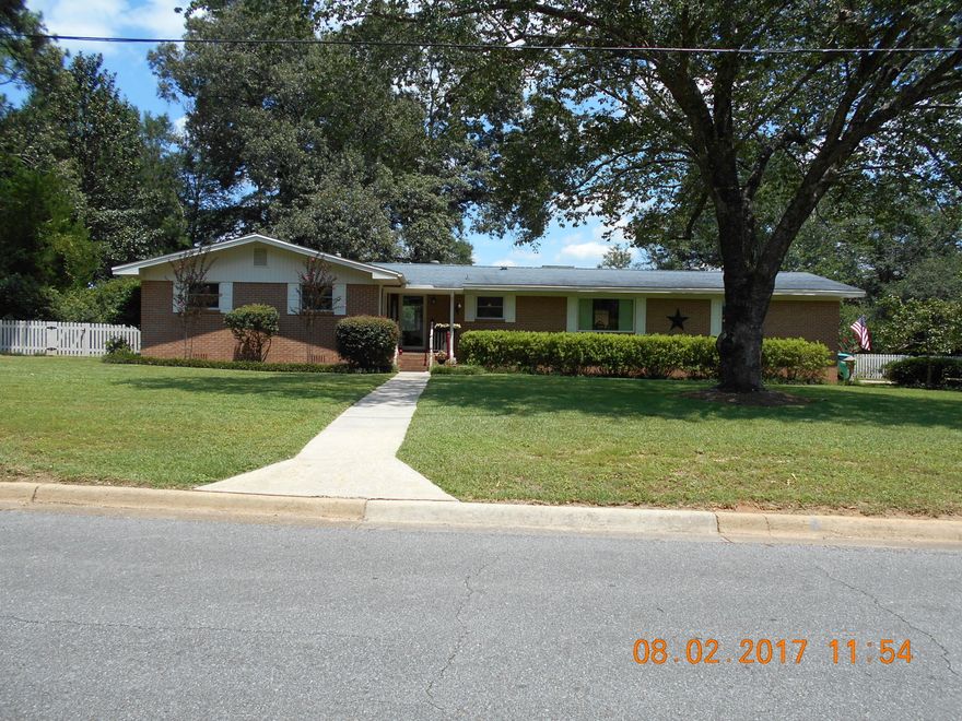 Don't let the age of this beautiful home fool you~ This home has been upraded with new double pane vinyl windows, new insulation blown in attic, new storm doors, new water heater~ Large kitchen upgraded with white shaker cabinets, soft close drawers, granite counter tops & stainless steel appliances~ Master bath has walk in shower with subway tiles & new vanities in both baths~ Quarter sawn white oak floors grace this home in living areas and bedrooms~ Formal living room, den, formal dining~ 3 Bedrooms, 2 baths, laundry room~ Large beautiful covered deck looks onto the beautiful back yard that has new fencing, flower gardens, Koi pond, green house and new shop/yard building~ This home has so much to offer and in the much desired Adams Powell subdivision~