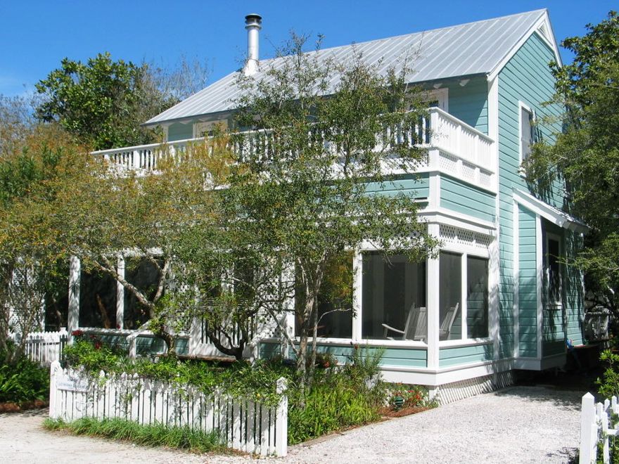 This light filled, spacious cottage is a family dream house. Built to last in the classic Seaside style with all wood interiors, Seas the Moment was designed by award-winning architect Deborah Berke and has been impeccably maintained by its owners. Located on charming, quiet Savannah Street, it is midway between beach and pool, yet away from it all. The house speaks comfort and easy living. A wall of French doors opens the capacious main floor living area onto a 28 foot wide screened porch that faces Savannah Street Park. Its open floor plan flows from living/dining room to a large kitchen. Right off the kitchen is a newly constructed screened porch that offers privacy for outdoor dining/relaxing. This outdoor living room overlooks a charming natural garden.