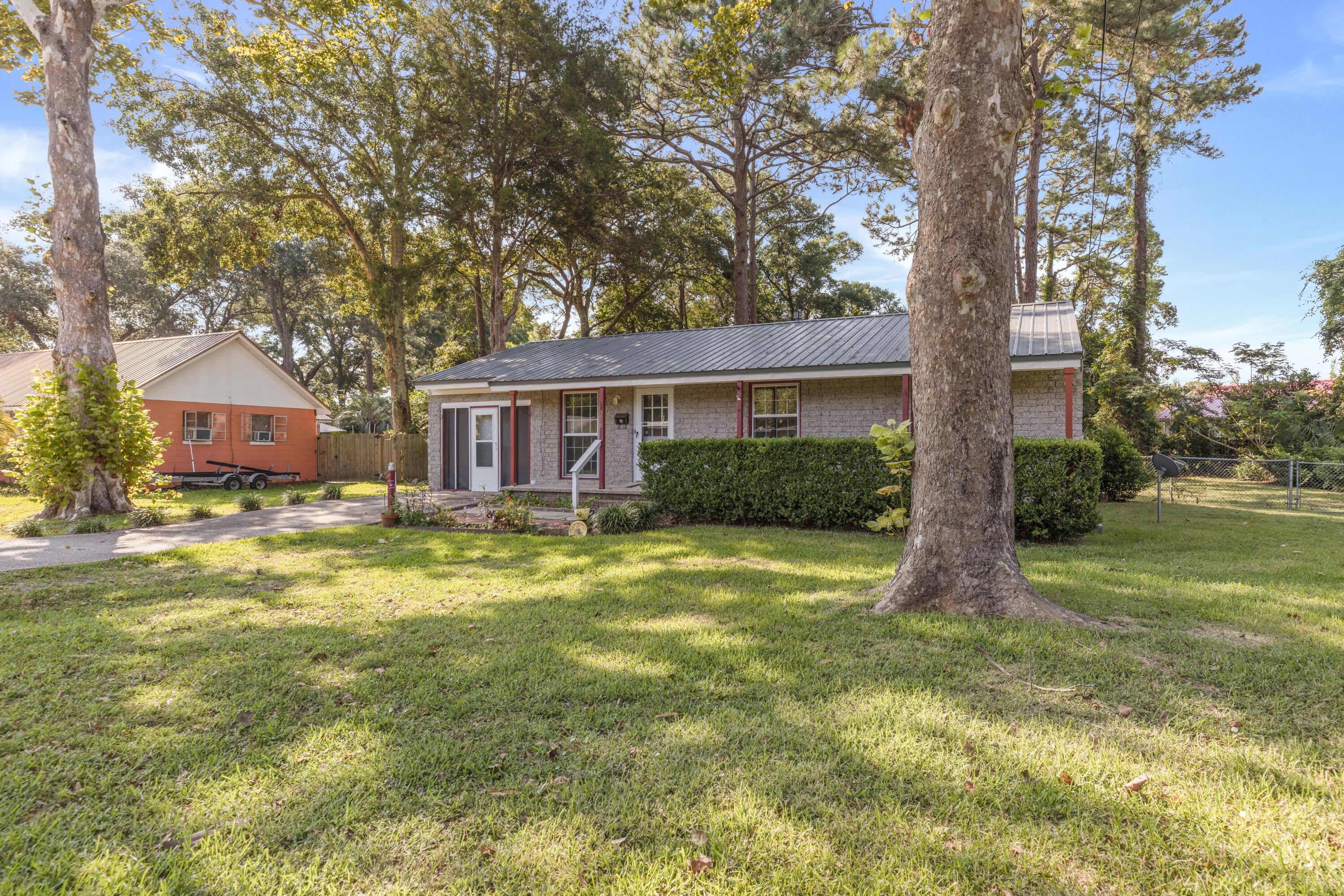 AVAILABLE NOW... 3bd/1bth NEWLY RENOVATED, ranch style home! This home sits less than one mile to water access and beaches at Choctawhatchee Bay and less than two miles to the beautiful Emerald Coast white sand beaches and all Okaloosa Island has to offer! Home sits on one of the larger lots in the neighborhood at .35 acres. Be impressed by the curb appeal featuring large mature trees, colorful landscaping and metal roof. Enjoy your evenings in the one car garage that has been partially converted to additional living space with screen door entry, backyard access, storage cabinets, window AC and more. NO smoking. Pets allowed upon approval with a non-refundable pet fee. 600 minimum FICO credit score required in addition to meeting rental criteria. AS IS Washer/Dryer.
