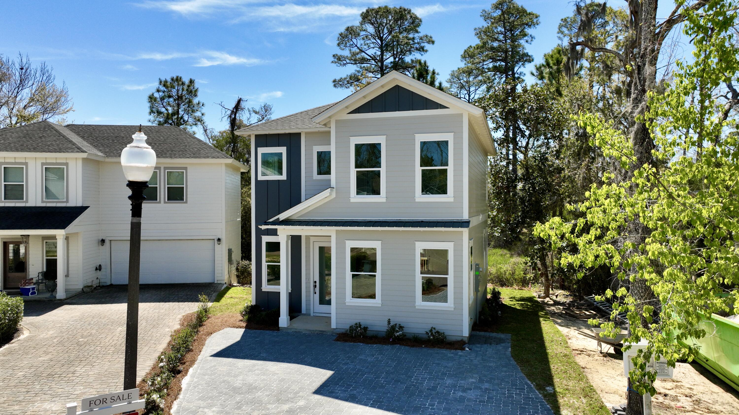 GREAT OPPORTUNITY TO USE OUR PREFERRED LENDER, OFFERING A COMPETITIVE RATE OF 4.99% (This option is subject to the qualifications set forth by our preferred lender) OR A CASH CREDIT OF $15,000 AT CLOSING! Stunning 3-Bedroom, 3-Bath Home in the Serene Sacred Oaks Community. Nestled in the peaceful and picturesque Sacred Oaks neighborhood, this charming 3-bedroom, 3-bath home offers 1,735 sq ft of thoughtfully designed open living space. With 10-foot ceilings and a central kitchen, this home is perfect for both entertaining guests and relaxing with family.The spacious kitchen boasts stacked cabinets and an island for additional storage and counter space, ideal for meal prep and hosting. The clever use of space continues with a convenient storage area located beneath the stairs, accessible from the outside of the home.
At the rear of the house, the master bedroom is a serene retreat, offering a beautiful view of lush trees, magnolias, pines, and vibrant greenery. The timeless en suite bathroom ensures a luxurious experience, making this the perfect place to unwind after a busy day.
Sacred Oaks is just minutes from the stunning beaches along 30A, and a short bike ride from the area's most popular restaurants, Grand Boulevard, and the Sandestin Outlets. The community dock, accessible via a scenic wooden bridge, provides a peaceful spot to enjoy the bay. A private backyard where no home can be built behind.
With a no short-term rental policy in place, Sacred Oaks maintains a tranquil atmosphere, ensuring this beautiful neighborhood is a quiet and welcoming place to call home.
Don't miss the opportunity to experience the best of bay-side living in this beautiful home. Contact us today to schedule a tour!