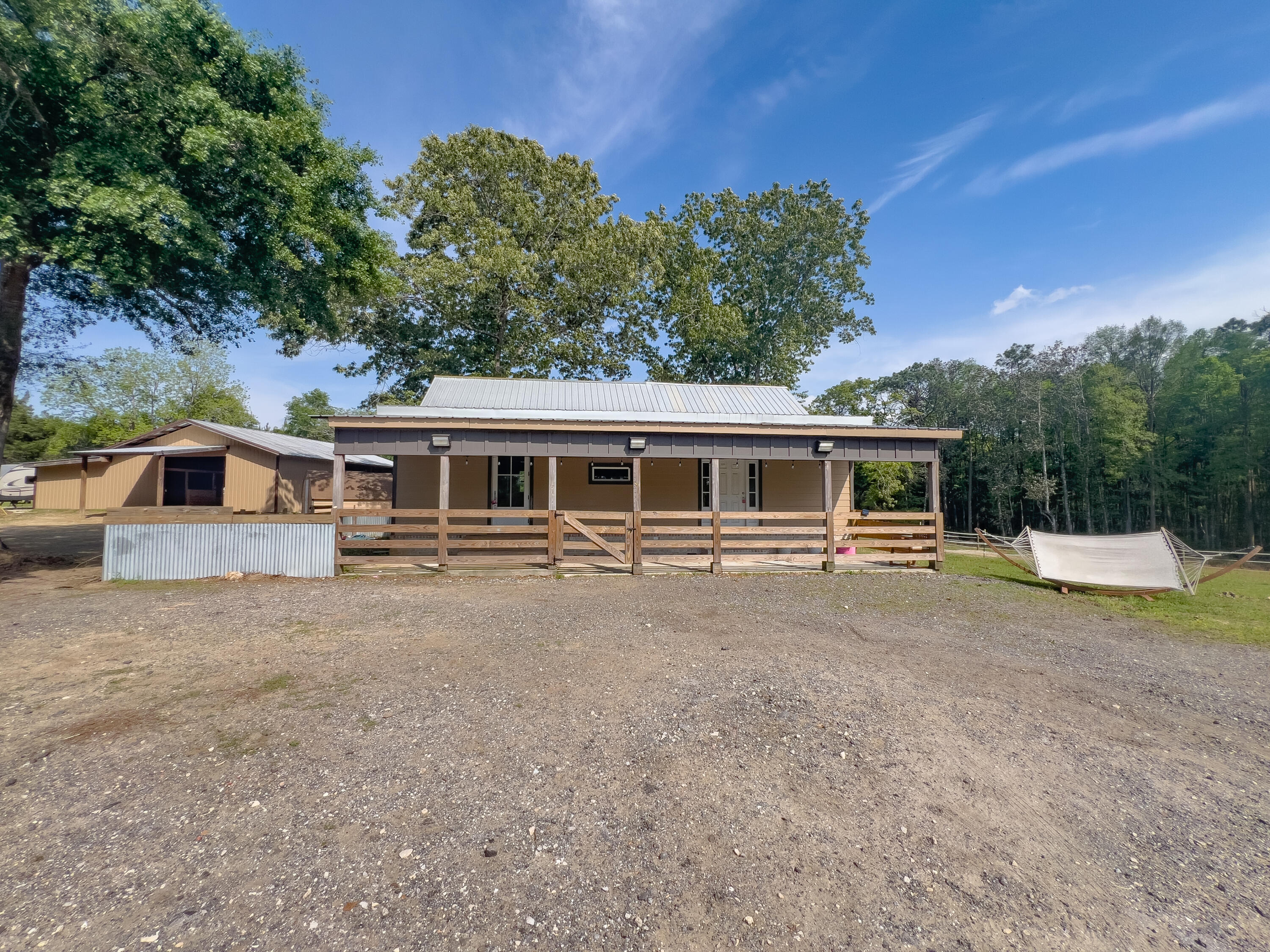 Available May 1, 2025! A horse lovers dream! 2/1 home, 6 stall horse barn, barn room, can be used for tack, on 11.5-acres partially fenced. This unique 2-bedroom, 1-bathroom house with a loft combines the tranquility of rural living with the coastal design and feel, creating a truly captivating and harmonious living space only 1 hour away from the beautiful Destin beaches. The thoughtful design, natural surroundings, and versatile living spaces make this property an inviting haven for those seeking a laidback lifestyle to enjoy horses and livestock. Bring your horses and relax on the front porch in the evenings! washer and dryer included but As-Is. Applications are done online at www.rentgoodlife.com