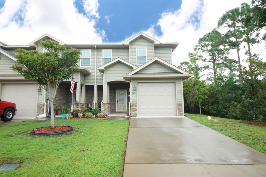 BACK on the market, buyer got cold feet! Nestled in a soundfront community, this 2017 built townhome welcomes you in with a Craftsman style stacked stone entry then brings the bling with upgrades galore! You won't find another like this one: two HVAC units, extra soundproofing, walk-in tiled shower, 18 gauge metal garage door, and 2 extra windows that bathe the living room in light. This END unit has lovely granite counter tops are in the kitchen and baths, with designer lighting and cabinetry to complete the look. The downstairs features custom tile and paint, and even the back patio has upgraded pavers. This is turn-key luxury! The community has a sparkling pool and access to the Santa Rosa Sound.