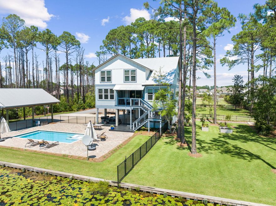 Secluded South of Hwy 98 this gated 4+ acre Dune Allen family compound has it all and with a quick golf cart ride you will be at the beach in less than 4 minutes. The 2 story custom built home & carriage house over 1 car garage, 30 x 24 wood pavilion for RV parking, with water and electricity hookup, saltwater swimming pool all facing the natural fishing pond with firepit & dock! The home with 3,100 sq ft, 4 bedrooms, 3 full baths, Power Room off the foyer along with the carriage house with bedroom, sitting area and full bath truly provide a haven for all - even the yard is fenced in for your pets. Downstairs of the main house is a conditioned storage area with a workbench along with additional storage closet in carport, outdoor grilling station with sink, refrigerator and DCS Grill, two