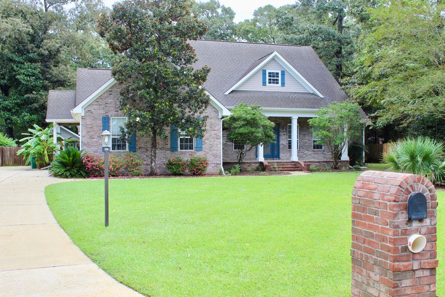 Beautiful home with a chef's dream kitchen with lots of room for entertaining. The kitchen has a bar and breakfast area over looking the back yard!This beautiful custom home has many features to included bamboo flooring through out the living room, hall and all bedrooms the rest of the house has tile, 9'' crown molding in most rooms, 2'' wood blinds convey, under-counter lighting, surround sound (whole House) with separate zones with speaker on the porch, built-in shelves & storage, mostly 8' doors for that wow factor, and so much more! The kitchen features solid surface countertops, stainless steel appliances, a DCS commercial oven w/6 burners, a center island with sink and a big bar for sitting around. The living room is open to the dining room and kitchen and spacious laundry room