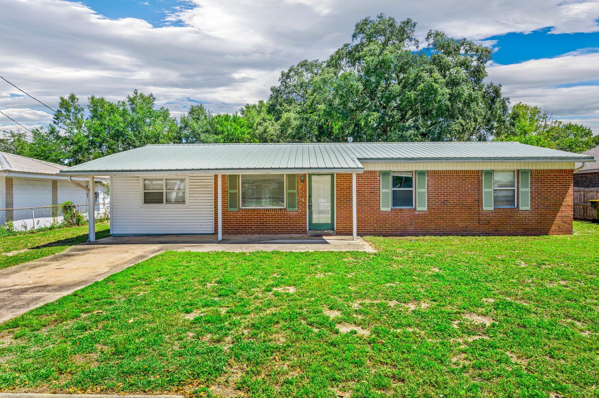 INVESTOR / FLIP ALERT.   Brick home featuring four bedrooms and two baths on one quarter acre with Metal Roof.  This sturdy home features Updated Windows, Updated Vanities, and an Updated Kitchen with solid wood cabinets and Stainless Steel Appliances.  Seller is replacing Hot Water Heater prior to closing.  Convenient location only 10 minutes from the beaches of Okaloosa Island, Hurlburt Field, and Eglin Air Force Base.  Call to book your tour today - this will not last long!  Perfect as a family's first home, or, would make a FANTASTIC long term rental investment property.