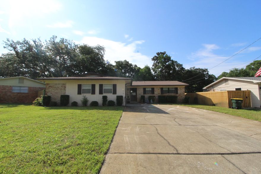 FANTASTIC LOCATION! Wonderful all brick family home situated in the heart of Fort Walton Beach in a nice neighborhood. Step into the foyer to find parquet flooring throughout. Living room has skylights, corner fireplace with tiled front and custom oak mantle, and newer French doors that lead out on a screened-in Florida room. Kitchen has lots of cabinets, counter tops with a built-in table height breakfast bar, built-in desk, tiled back splash, stainless and black appliances to include a smooth top stove, pantry and tile flooring throughout. Dining area is open to the kitchen making entertaining easy. Spacious master bedroom with a private master bath that has a custom walk-in shower. Two additional bedrooms and a full bath complete this home. Side entry garage with laundry area