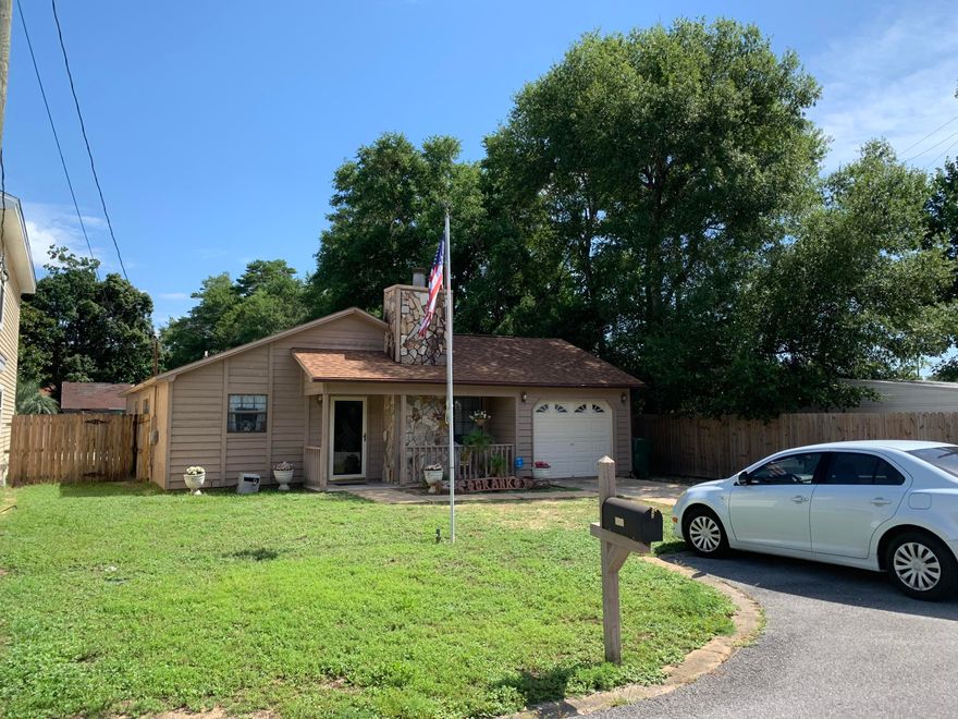 This great 3 bed, 2 bath, 1 car garage IN GROUND POOL home offers cathedral ceiling and stone hearth fireplace in the living room, separate dining area, updated kitchen with white cabinetry, newer counter tops and newer stainless steel appliances. Updated wood flooring in living room and hall and tile in bathrooms and kitchen. Also features ceiling fans throughout, large closet in master bedroom and updated vanity in master bathrooms. Dimensional shingle roof brand new in 2017. The kitchen has gas range/oven. Exterior has an IN GROUD POOL and is fully fenced. Located in the heart of Niceville near Northwest Florida State College, the Niceville Children's Park, recreation fields and A+ rated schools.