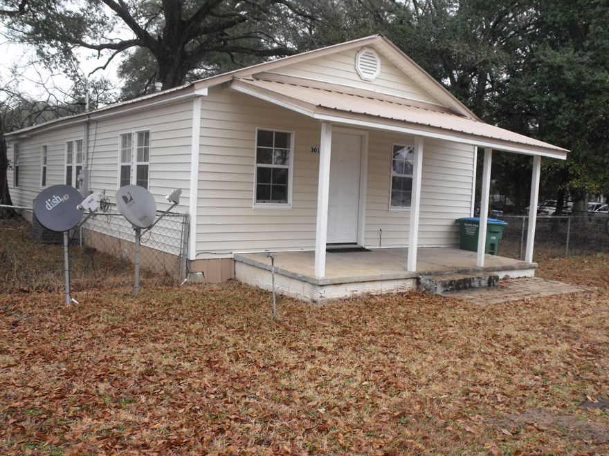 Great starter home or investment opportunity! Seller will pay some of the buyers closing cost and provide 1 year American Home Shield home warranty. House was completely renovated in 2006, with new central air conditioner, metal roof, thermopane windows, upgraded kitchen, all new sheet rock and both bathrooms were redone as well. Level back yard completely fenced in with chain link fence. New wall to wall carpet is in all bedrooms and living area.