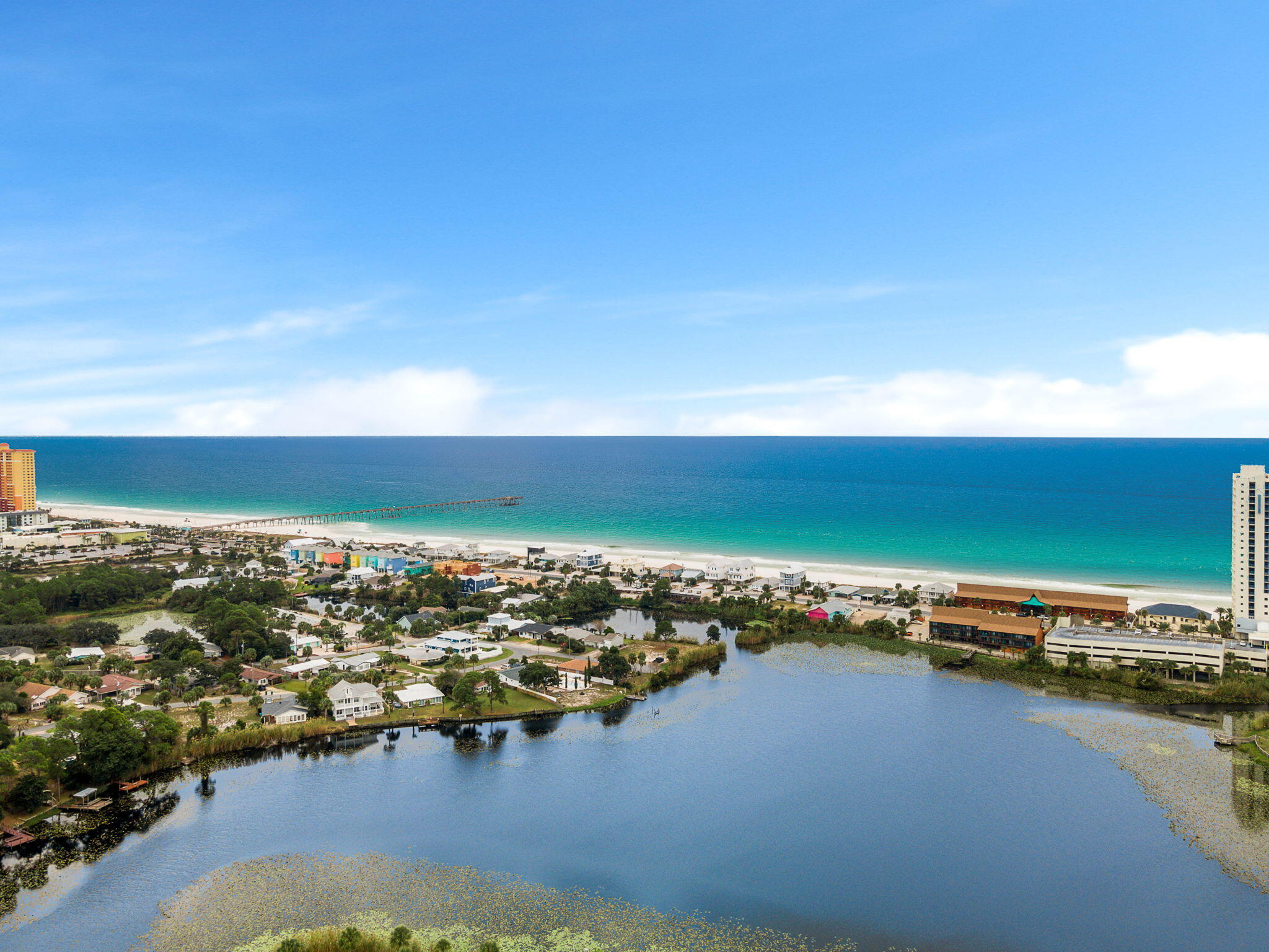 This beautifully renovated 3-bedroom, 3-bathroom single-family gem is a showstopper. Walk, bike, or golf cart to the pristine beaches of the Panama City Beach.1,512 sq ft of thoughtfully designed living space, this home combines modern elegance with ultimate comfort. High end kitchen and appliances with chic finishes to satisfy your culinary desires. Updated bathrooms for spa-like tranquility. Stylish new LVP flooring throughout the living areas. Prime location within walking distance to Pier Park's attractions. So close, yet peaceful and serene. The yard is a private oasis equipped with a hot tub after a long day. Step into your dream home. This is a must-see gem for those seeking a coastal lifestyle that offers both comfort and style, $67k in projected annual income.  in a prime location. Don't miss out on this opportunity to own your piece of paradise. No HOA or dues. A private neighborhood with no rental restriction as only a few in this allowed in this beach community. Close to 30A, Inlet Beach, grocery stores, Dillards, Fresh Market, Target, along with too many others to mention.