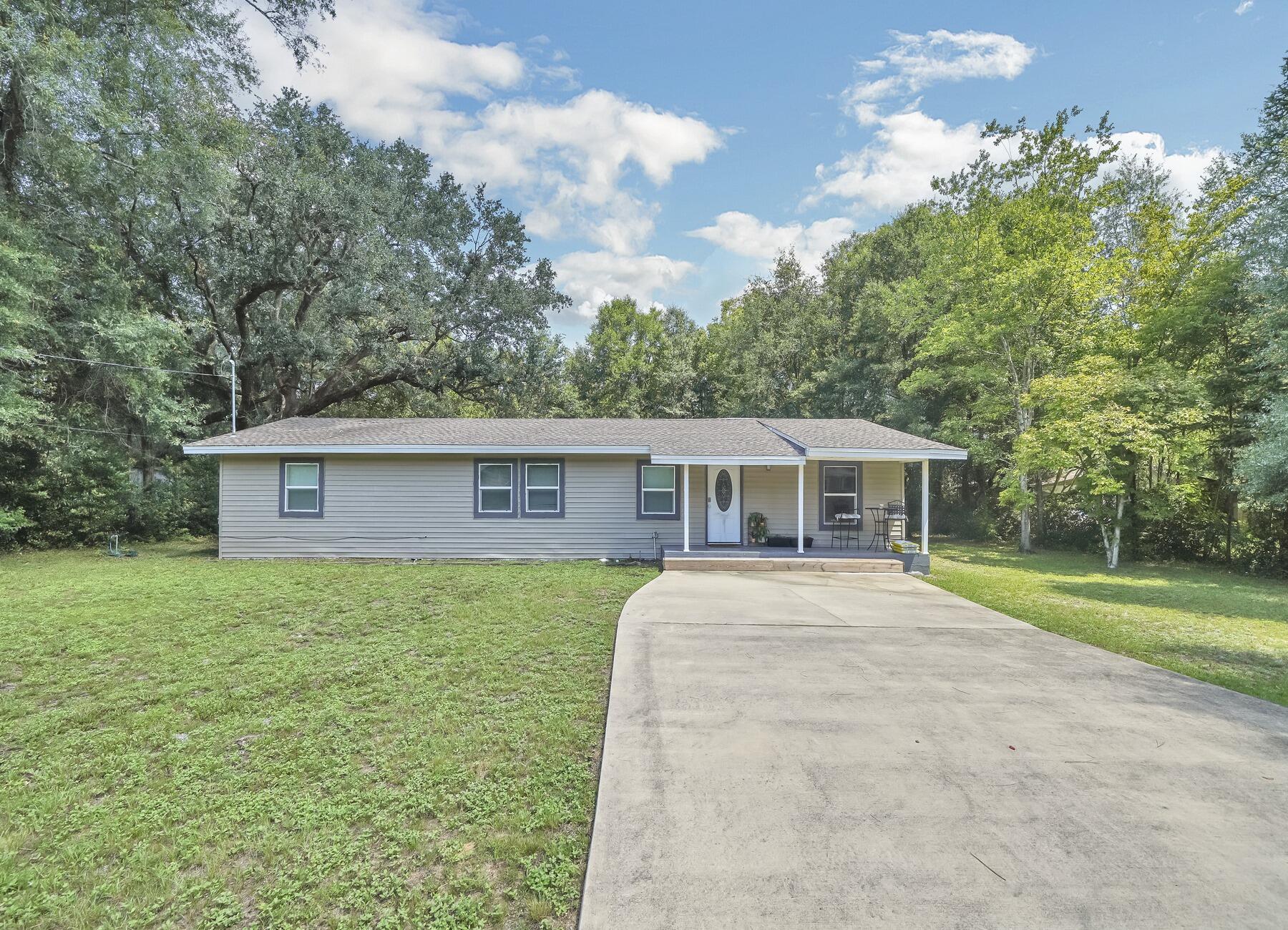 Welcome home to this spacious 4 bedroom 2 bathroom home, with two living areas! This sweet home was renovated approximately 4 years ago with a new roof, windows, HVAC, and siding! Plenty of activities to do on the 1/2 acre that this home sits on, located in the center of Crestview, close proximity to Duke AFB, and approximately 22 miles to Eglin Air force base.Bar, wood bench, and bar cart all convey with the property, made by the seller! Call today to make this yours! Would make for a great first home, or an investment property!
