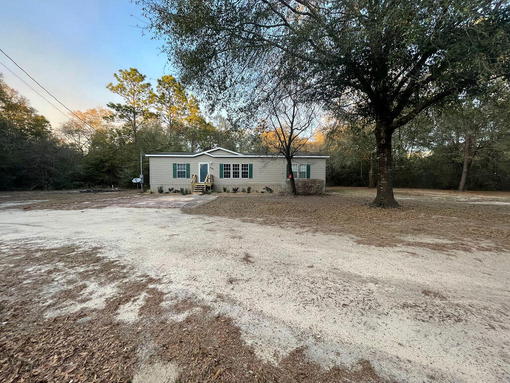 **BACK ON THE MARKET DUE TO NO FAULT OF THE SELLERS** The kitchen offers NEW cabinetry, NEW countertops, updated pantry , NEW vinyl plank flooring in Kitchen, Dining, Living room and Laundry room. NEW carpet in bedrooms. Master bedroom has beautiful wood flooring. Freshly painted walls thru out with updated baseboards. Dishwasher replaced in 2020, Refrigerator replaced in 2021, Stove replaced in 2022. Check out the beautiful NEW shiplap electric fireplace in the living room. Dining room offers plenty of room for large family gatherings. This home is easily accessible to Hwy 393, Hwy 90 East, and easy commute to the beautiful sandy beaches in Destin, Fl. Replacement of drain fields were also done in 2021. Buyer to verify measurements and anything of importance. Sold As-Is
