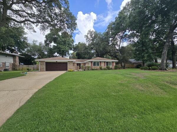 Experience elevated living at 149 Raintree Blvd in the highly sought-after Raintree Estates of Niceville. Positioned on high ground, this thoughtfully renovated 4-bedroom, 2-bathroom home offers 2,125 sqft of indoor comfort paired with beautifully designed outdoor living. Renovations completed between 2019 and 2022 include a newer roof, energy-efficient windows and doors, upgraded flooring, and fully remodeled bathrooms that bring a spa-like feel to everyday life. A highlight of the home is the expansive covered deck featuring a built-in Echelon grill and comfortable seating area, perfect for relaxing evenings or weekend entertaining. Smart technology upgrades include a programmable thermostat, lighting, sprinkler system, doorbell, and a whole-home generator for added convenience and peace of mind. The custom kitchen is designed with cherry wood cabinetry, granite countertops, smart stainless appliances, a wine/beverage cooler, and built-in storage, all open to the dining area and main living room anchored by a wood-burning fireplace. A second living area offers flexible use and direct access to the backyard.
The primary suite features French doors leading to the private backyard, a spacious vanity, soaking tub with a shower. Three additional bedrooms offer ample closet space and versatile layouts. The guest bathroom includes a tiled walk-in shower, granite vanity, and a smart light/fan/speaker fixture.
Step outside to enjoy a fully fenced backyard oasis, ideal for entertaining, relaxing, or hosting family gatherings year-round under the covered deck.
As a resident of Raintree Estates, you'll have the option to join the voluntary HOA, which provides access to two private parks: "The Woods," with walking trails and native landscaping, and "Bayfront Beach Park," a waterfront area featuring a beach, kayak launch, picnic pavilions, and grills.
Whether you're looking for a full-time residence or a serene retreat on the Emerald Coast, this home blends modern upgrades, thoughtful design, and exceptional location.