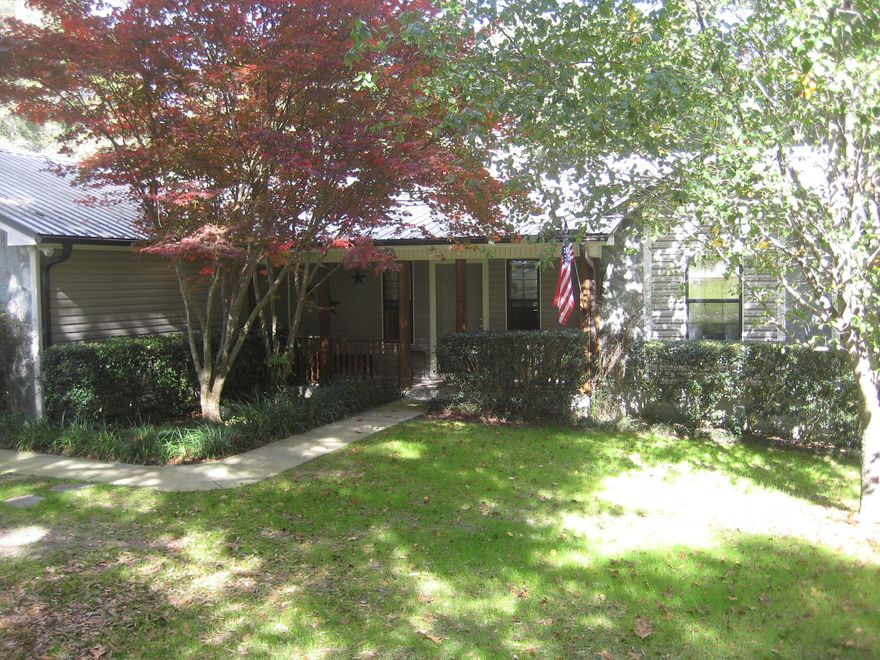 Wonderfully updated and well-maintained family home on an acre in the sought after Kennedy Lakes subdivision! Pride of ownership is apparent in this great 3 bedroom and 2 bath home with a 2 car garage. Curb appeal is readily apparent when you pull up to this charmer. Entire yard is wonderfully landscaped and offers a peaceful sanctuary right in the city. Enter the home from the covered front porch into a quaint foyer and then on into the living room with a great wood burning fireplace as the focal point. Split bedroom design with the guest bedrooms being to the left of the living room. From the living room you enter the quaint kitchen and breakfast area with the master bedroom beyond. Master is roomy and overlooks the picturesque back porch and the lawn beyond. Ample storage