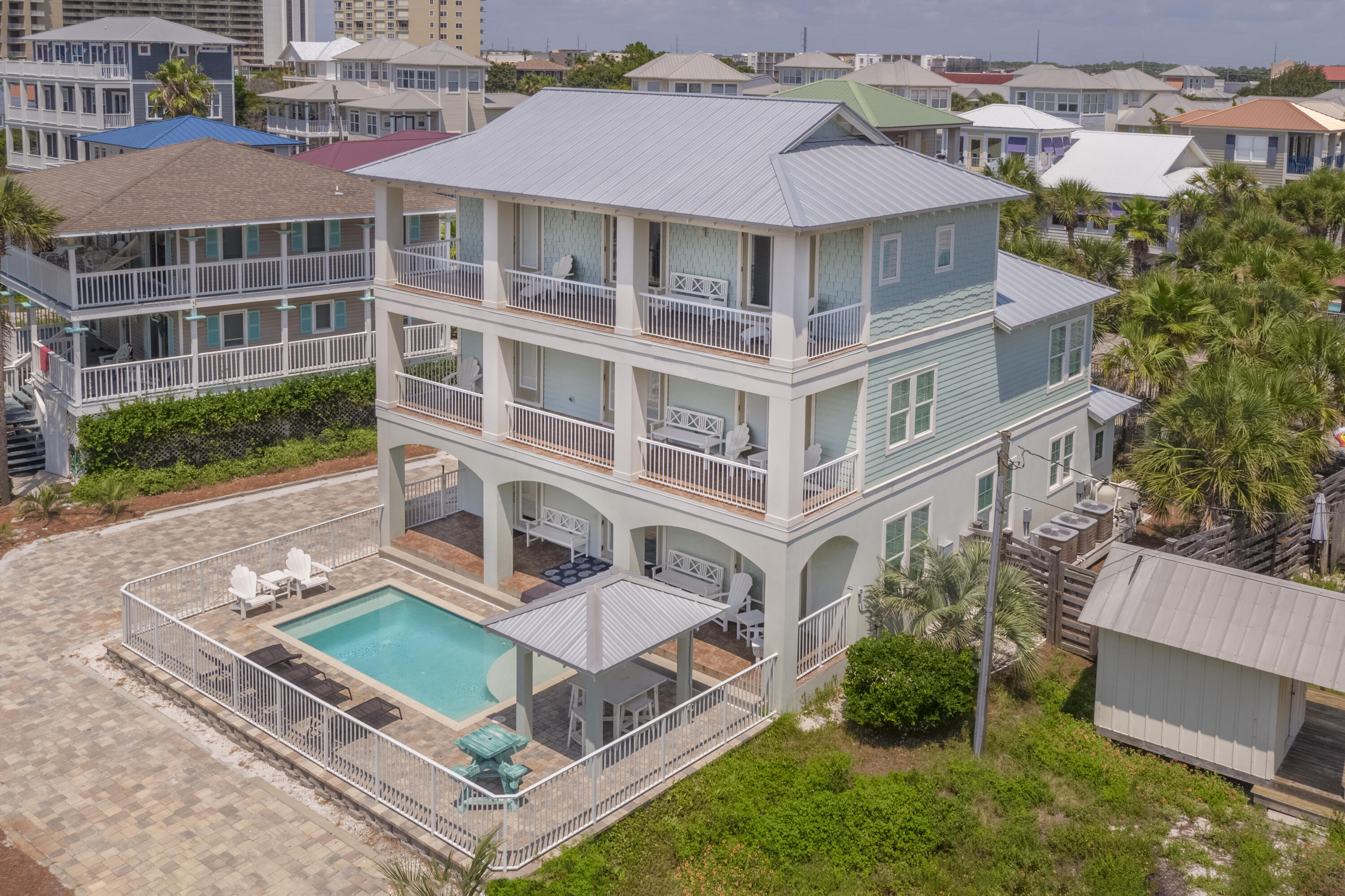 This magnificent beach home in the heart of Miramar Beach features 7 bedrooms & 6 baths to accommodate up to 21 guests. ''Breeze on Inn'' is professionally decorated including marble counters, stainless appliances, tile throughout & a private pool with veranda & gazebo for your relaxation when not lying on the beach which is directly across the street. 1st Floor has Kitchen, Den ,Utility Room, King & Queen w/full baths. 2nd Floor has a second Den, King Bedroom w/Twin Sleeper, Bath, Bunk room, King Bedroom w/bath, & the 3rd Floor features a Sitting Area with Two Twin Sleeper Sofas, & 2 King Bedrooms with baths. Home has been impeccably maintained and shows like new. Close to all the Emerald Coast has to offer, this home is the ideal investment or second/primary home opportunity. Call and