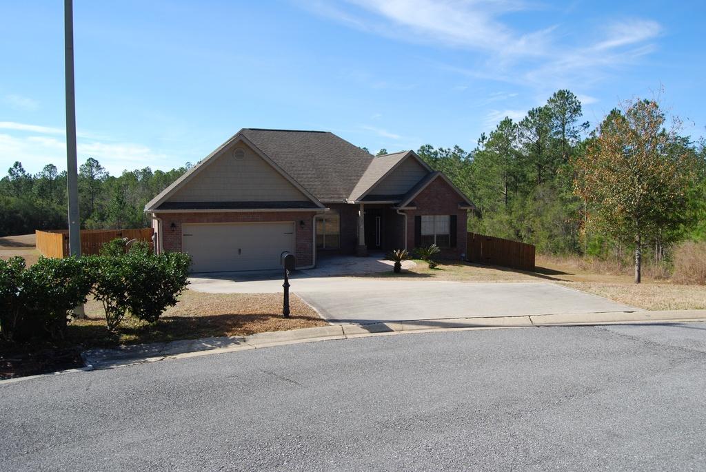 Welcome to your new home! This 4 bedroom 2.5 bathroom open floor plan was built in 2010. Formal entry way is wood flooring that leads into your first bedroom on the right and your formal dining room on your left. Walking straight ahead you enter into tile living room with vaulted ceiling and with a fireplace. Two more bedrooms are located off of the living room with a full bath nestled in between the bedrooms. Off the living room is your open kitchen. The kitchen has a high countertop to entertain guests and breakfast area. The kitchen has stainless steel appliances and built in pantry. From the kitchen you walk down a hallway into your master bedroom.