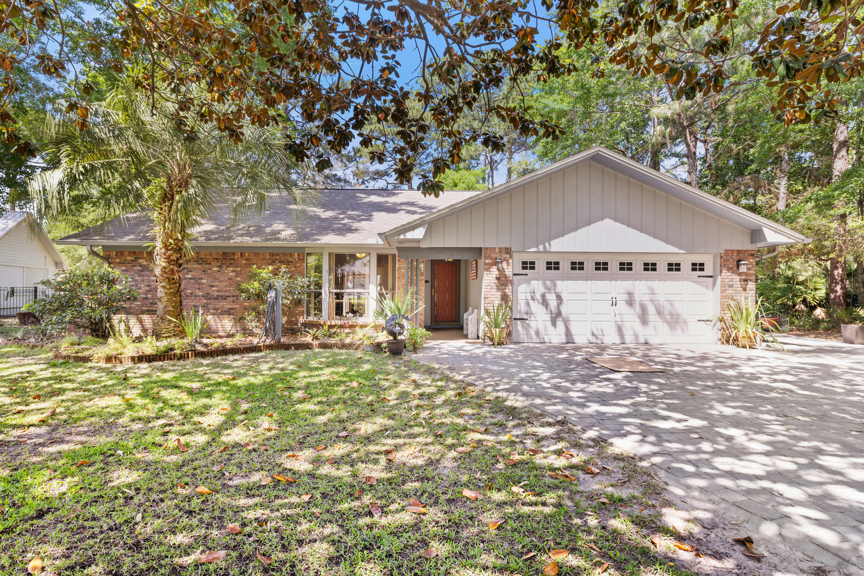 Welcome to 702 Prestwick, a stunning property nestled in the heart of Niceville, FL. This charming home has undergone a complete transformation, boasting completely remodeled bathrooms, refinished ceilings, new floors and carpet, as well as fresh paint inside and out. The addition of a brick driveway with a wrap-around walkway to the back deck adds a touch of elegance to the exterior, while the new back deck provides the perfect space for outdoor relaxation.Inside, you'll find an abundance of storage thanks to the increased attic space and built-in adjustable bookshelves. The whole house fan allows you to bring in the fresh spring air, creating a delightful atmosphere throughout the home. To learn Moore click the more info button.