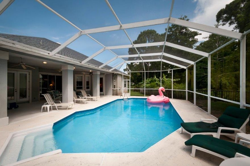 Location, Location! Close to beaches & shopping. Contemporary split bedroom floor plan in desirable neighborhood located on Cul-De-Sac with a large yard. Enjoy your days & evenings in the backyard with the screened in pool and large covered patio.There is also a outdoor shower and Pool equipment room with a Half Bath. Inside you have 3 doors leading to patio/pool area, lots of natural light, high ceilings, built in features, formal dining, breakfast nook and breakfast bar. This is a great home, you don't want to miss this one. Call & Book your showing today!