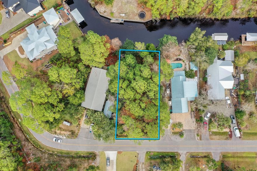 A rare opportunity to own a canal front Lot in the historic Daughettes of Point Washington. This stunning lot is just a short drive to Grayton Beach(consistently Doctor Beach's top contender for ''Best Beaches in the World''.) These rare canal front lots are deep water(up to 5' in center), have easy access to the bay and a voluntary canal association to keep lots dredged to maintain depth. Also, easy access to highway 98, allowing you to explore the nearby shopping, dining, bike paths, hiking trails, beaches and farmers markets. This would be a great place to build your dream home! Ask agent for more details or a boat ride to view the lot from the water.