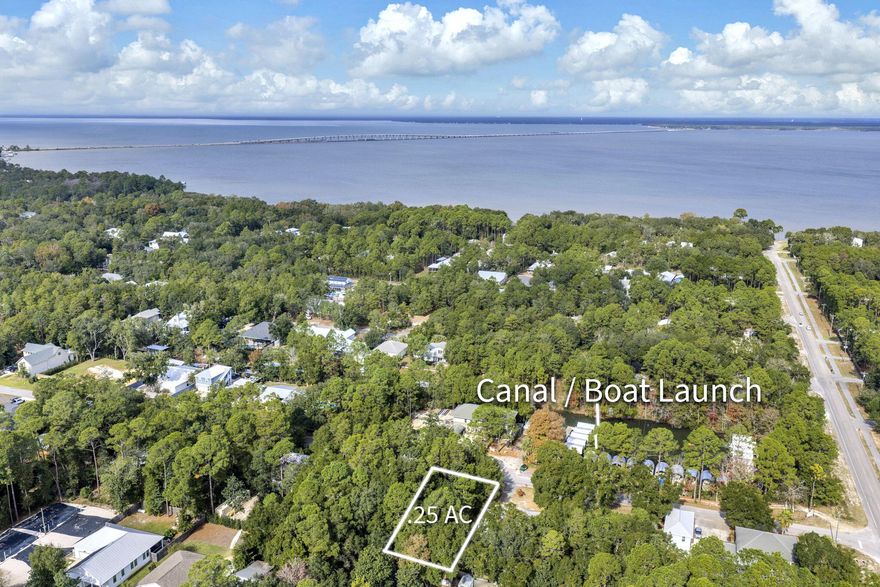 Build your dream home in one of Point Washington's most desired neighborhoods, The Daughettes, just minutes from the world-class beaches of 30A. This quarter-acre lot sits in an established community known for its charm and coastal character. A private, members-only boat launch is located almost across the street, giving you rare deepwater access in a residential area. From the canal, you can easily reach the Intracoastal Waterway, Choctawhatchee Bay, and Gulf routes. Head west toward Destin, Crab Island, and the Destin Pass, or go east toward Panama City Beach and Shell Island.With 3.5-mile access to the beach, plus renowned dining, shopping, and entertainment options nearby, this location offers the best of both worlds. Enjoy close proximity to the Point Washington State Forest, where miles of scenic trails invite peaceful walks, biking, or quiet outdoor moments. Whether you're an avid boater, a nature lover, or simply seeking a tranquil place to build, this property is a blank canvas with no HOA and endless possibility.