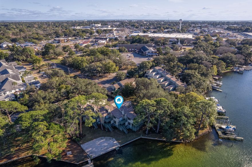 Embrace the best of waterfront living in this 3-bedroom, 3-bathroom townhouse with breathtaking views from the dining room, living room, and master suite. Relax on your private balcony overlooking the bayou or take a short stroll to the nearby park. The updated kitchen, with granite countertops and new cabinets, is perfect for quick meals before heading out on the water. The formal dining and family rooms feature elegant tile accents. Upstairs, the master suite offers stunning views, a whirlpool tub, and a private balcony. With built-in garage storage and a beach area steps away, this is Florida living at its finest!