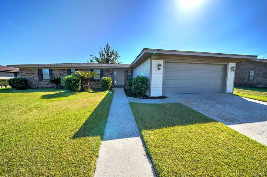 Move in ready! This large 4 bed, 2 bath mostly brick home is complete with new roof, siding, paint, garage door, shutters, flooring, paint, doors, lighting, and more. HVAC is also new. Recessed lighting and Beautiful arched accents in the main area. Nice sized foyer, formal dining room and family room. The guest bath has a double vanity. The master bath is updated with a newer vanity. The oversized lot makes for a nice sized back yard with a concrete patio for entertaining and an irrigation system. Near TAFB.