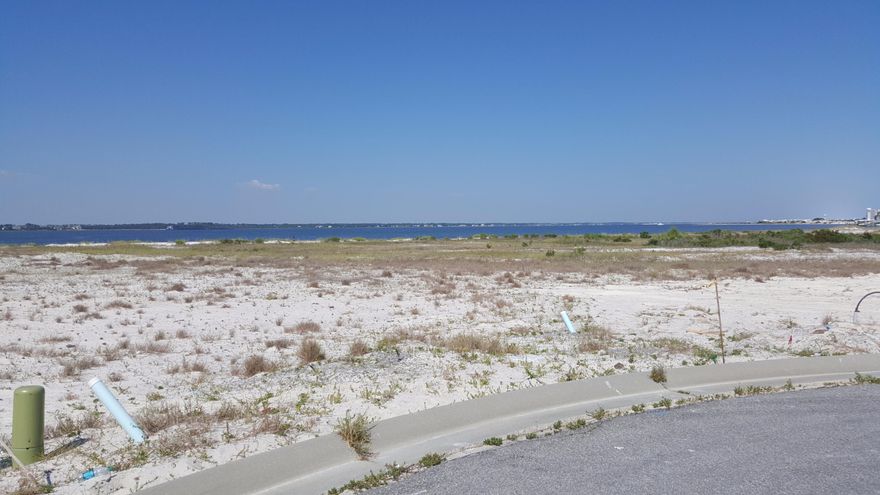 Beach living with ample garage space? With closet space? Say it isn't so! Check out the Bimini floor plan. Come relax in this home with views of the sound and the Gulf, raise a glass, and toast your new beach home, with 4 bedrooms, 4.5 baths, and plenty of room to just be you. Enjoy beautiful granite countertops, gourmet kitchen, while you cook the fish you just caught. You, too, can live on the beach year round. Why not, when this community is less than a half a mile from USA Today's #1 Rated Beach in Florida! Quality construction, very little yard work, beach lifestyle; how can you go wrong? Navarre Beach is growing. Don't miss your chance to buy at this price! Pictures, photographs, colors, features, and sizes are for illustration purposes only and will vary from the homes as bui