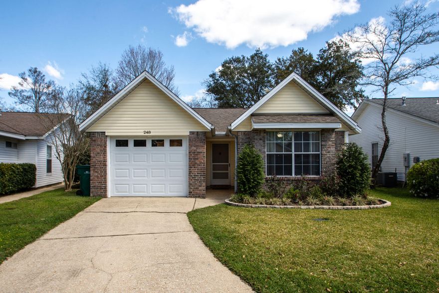 3 bedroom home in a highly desirable Bluewater Bay neighborhood. Low maintenance brick and vinyl siding home features a vaulted ceiling and wood burning fireplace in the living room and a spacious screened porch off of the dining area. Home has been updated with dimmable can lighting, luxury vinyl plank flooring, fresh paint and a newly remodeled bathroom.  This home is incredibly convenient to everything and walkable to school, restaurants and shopping. It is only minutes away from the EOD school or Eglin AFB. HOA cuts the front lawn, trims the hedges, mulches yearly and maintains the sprinkler system. Call TODAY for your appointment!