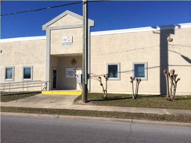 Large Box for office or can be built out for retail, located at a major intersection in Panama City Beach FL, 10,000 sf large parking area, great visibility, many different uses for this space.