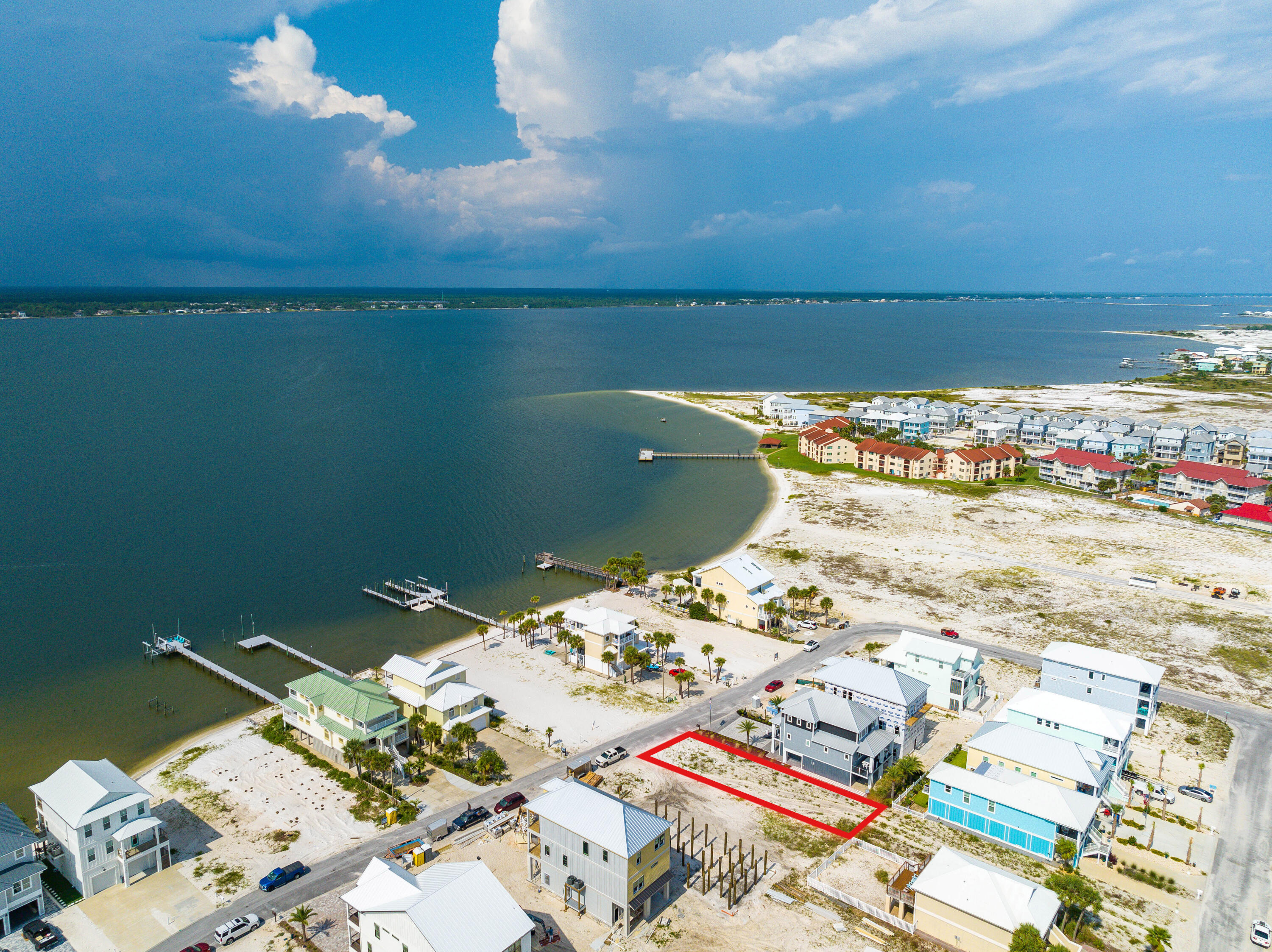 BEST PRICED LOT ON THE BEACH!! Reduced by $50K! Incredible opportunity to build the beach home of your dreams in a community with no HOA on Navarre Beach. Grand Navarre is a thriving community that has become highly sought-after due to its charming atmosphere and close proximity to the beach. In addition to Lot 6's commanding 110ft depth and 40ft frontage, its prime location within Grand Navarre features views of the Santa Rosa Sound and positions your future beach home just a 6-minute walk or an even quicker golf cart ride to enjoy the sandy shores of the Gulf. In addition to its Sugar Sand shores and Emerald hued waters, Navarre Beach offers a wealth of amenities and recreational opportunities. Take advantage of the nearby state parks, trails, waterfront and water-sporting activities Shopping, dining, and entertainment options are also easily accessible, ensuring that you have everything you need within reach.
Don't miss out on this remarkable opportunity to own a piece of paradise in the flourishing community of Grand Navarre. With its ideal location, no HOA, and proximity to the beach, Lot 6 Blk B Grand Navarre is the perfect canvas for creating the coastal lifestyle you've always envisioned.