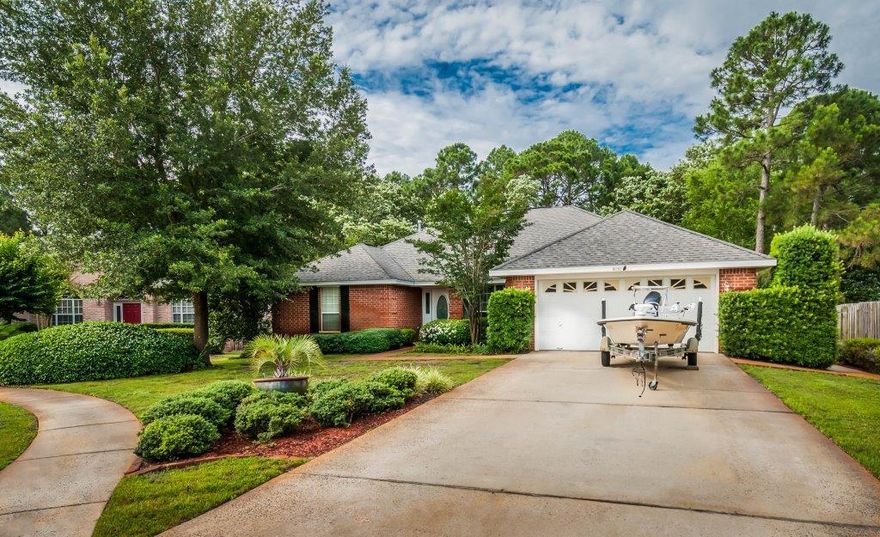 This is a 4 Bedroom 3 Bath all brick home located in a cul-de-sac and backs to a wooded preserve that will always ensure privacy. Professionally landscaped...the grounds are exceptional and the fenced backyard is like a ''hidden Garden'' out of a story book. Large great room with vaulted ceiling,built in niches, and a raised fireplace with mantle and surround. The kitchen has walls of cabinets and butlers pantry (a cook's dream)...the ceiling is vaulted...white raised panel cabinetry with crown and glass front doors...corian counters with integral double sinks.. Master suite is very large with ''his&her'' vanities with separate dressing table for the lady...large soaking tub...separate water closet & shower. The guest bedroom has a full bath Other Bedrooms share a Jack n Jill Bathroom
