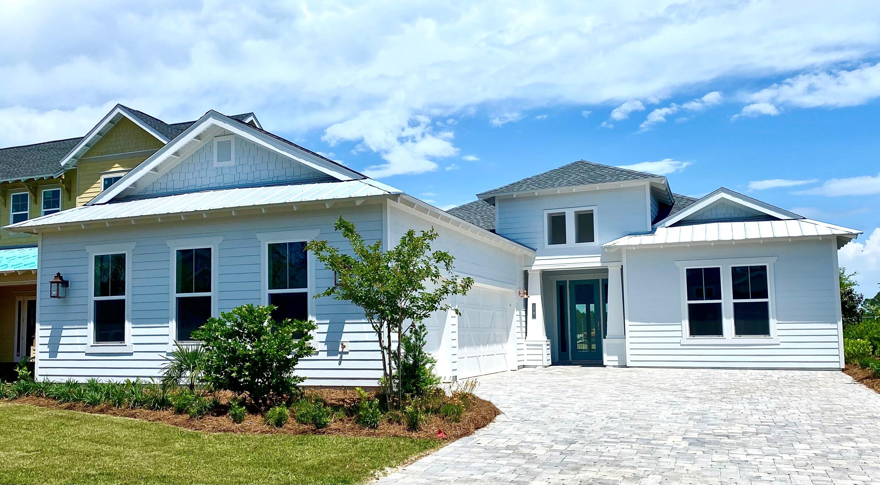 This gorgeous brand new home in popular NatureWalk at Watersound Origins is ready to go! This home is packed with every upgrade along with a heated saltwater pool and spa overlooking the lake. Open your five-panel sliding doors to extend the living area to the covered lanai for entertaining or just enjoying a meal right off the kitchen. The expansive living room includes a linear gas fireplace and the dining area will accommodate large tables for 12. There is a separate Den/Study/4th bedroom with sliding barn doors. Luxury Master Bdr overlooks the pool and lake. Master Bath features dual vanities with free standing tub and separate shower. 3 Car garage with golf cart charging, laundry room and storage area to handle 2nd refrigerator/freezer or additional pantry. Elegant Kitchen with Quartz