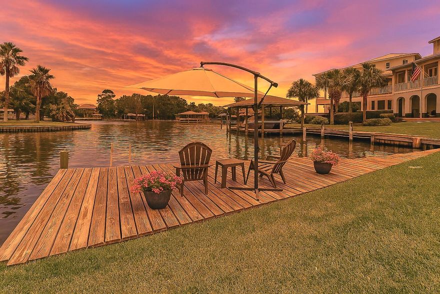 A one-of-a-kind canal-front home with the best water views in Gulf Breeze. Located on a deepwater canal with open water in your backyard, this property offers a peaceful setting with direct access to the Santa Rosa Sound. Charters frequent this area for its calm waters and prime fishing--you can catch redfish, trout, and flounder right off your dock.This spacious home features 4 bedrooms, 4 full bathrooms, 2 offices, a large open living and dining area, a separate den/playroom, and a private master wing. The master suite includes a sitting area, views of the sound, his-and-her walk-in closets, a full bath with separate shower and tub, and a private entrance with its own porch.The property has been extensively updated with fully remodeled bathrooms and kitchen, luxury vinyl plank flooring throughout all living areas, fresh paint, new fixtures and hardware, and a large walk-in pantry located in the butler's pantry/mudroom. The bright and open kitchen was designed for entertaining, with expansive quartz countertops, a custom range hood, double ovens, a large ceramic sink, stainless steel appliances, and a breakfast area overlooking the water.
Major renovations include a new roof, high-velocity hurricane zone (HVHC) impact windows, wood repairs and insulation, full exterior waterproofing and new siding, new HVAC systems with smart thermostats, and a transferable termite bondoffering peace of mind and move-in ready convenience.
Set on two lots, the fully fenced yard offers plenty of room for a pool and includes two gates large enough to accommodate an RV, boat, or trailer. The side yard is shaded by mature crape myrtles and is perfect for entertaining. Storage and parking are abundant with a huge four-car garage, massive floored-attic, covered double carport, and dual driveways.
Just a short boat ride away from Portofino & dining with live music, this home delivers the best of coastal Florida living. It is more than a home; it's a lifestyle waiting for you. Sellers are willing to offer concessions towards flooring & window coverings with an acceptable contract. 