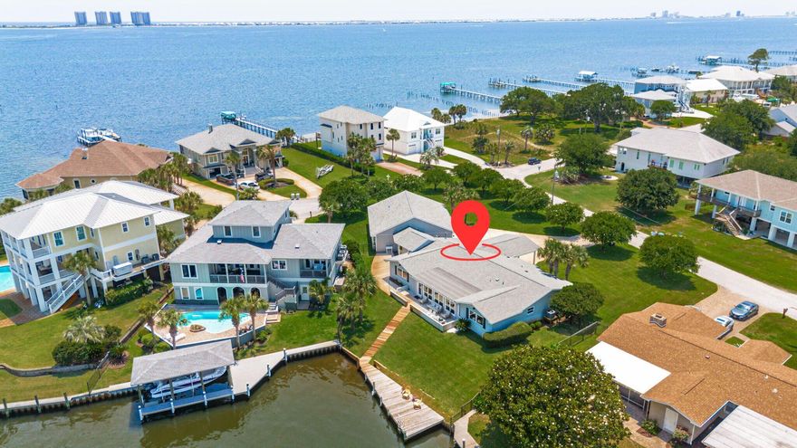 One-of-a-Kind Waterfront Canal Home on Two Lots - 4 En Suites, 4-Car Garage, Bring Your Boat!Beautifully maintained and fully updated, this spacious canal-front home offers deep water access and 70 feet of waterfront seawall. Located just seconds from the Santa Rosa Sound, the property features 4 bedrooms, 4 bathrooms, including a private wing Master Suite with sitting area, his/her walk-in closets, cultured marble bath, Jacuzzi, and a bonus room perfect for an office or additional bedroom. Ideal for multi-generational living with a separate entrance and utility room for a potential in-law suite.Interior includes two living rooms, two offices, semi-formal dining, custom kitchen with quartz countertops, large ceramic sink, stainless steel appliances, breakfast area with water views. custom pantry/butler's space, built-in shelving, laundry room, and a utility/mud room. Beautiful new LVP flooring in the main living areas. Tiled and carpet throughout bedrooms, baths, offices/laundry/pantry. Tons of storage including wall-to-wall floored attic space and ample closets.

Exterior features a NEW roof, hurricane grade windows, energy efficient AC units, fully fenced yard with plenty of room for a pool or future expansion, freshly painted exterior, Canal front dock with sunrise and water views, four-car garage, covered double carport, and dual driveways. Shown by appointment only; 30-minute minimum due to size.
OPEN HOUSE June 7th 10am-12pm
