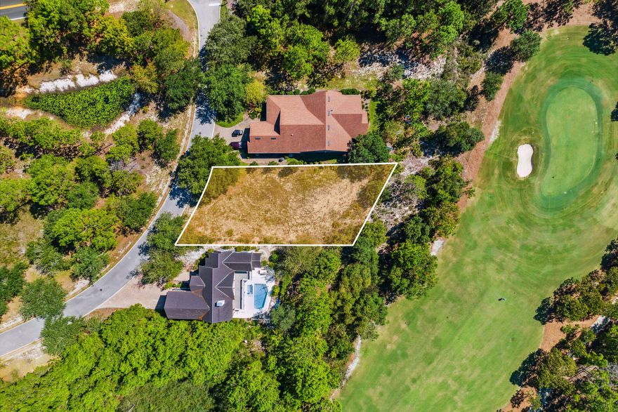 New price on this golf course front lot in the gated community of Wild Heron.  Wild Heron is a 734-acre sanctuary on the shore of Florida's largest coastal dune lake, Lake Powell.  You will enjoy the lakefront heated swimming pool, hot tub, fitness center, fishing dock boathouse with kayaks for resident's use to explore Lake Powell, lakefront boardwalk fire pit and a gathering area with fireplace overlooking Lake Powell.  Wild Heron is conveniently located between Rosemary Beach on Scenic Highway 30A and the west end of Panama City Beach which offers beach, restaurants and Pier Park.  This property backs up to the fairway of the 4th hole of the top-rated Greg Norman designed Sharks Tooth golf course and close proximity to the front of this lakefront coastal craftsman communit