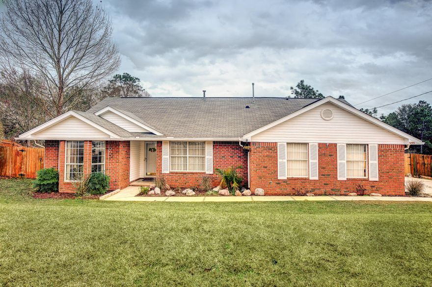 Beautifully renovated home SOUTH of I-10, close to schools, military bases, and amenities. This home has upgraded features galore and is move-in ready! New flooring throughout: hardwood flooring throughout the main living area, tile in all wet areas, and carpet in the bedrooms. Gorgeous kitchen with stainless steel appliances, gas range, and granite countertops with undermount sink. 3 backsplash selections available at showing for seller to install for buyer prior to closing! All bedrooms have large/walk-in closets and blinds and ceiling fans are found throughout. Home is also freshly painted and has a newer AC. Exterior includes a fully fenced backyard, sprinkler system, and drainage system that allows for ZERO water retention.Buyer to verify all information deemed pertinent.