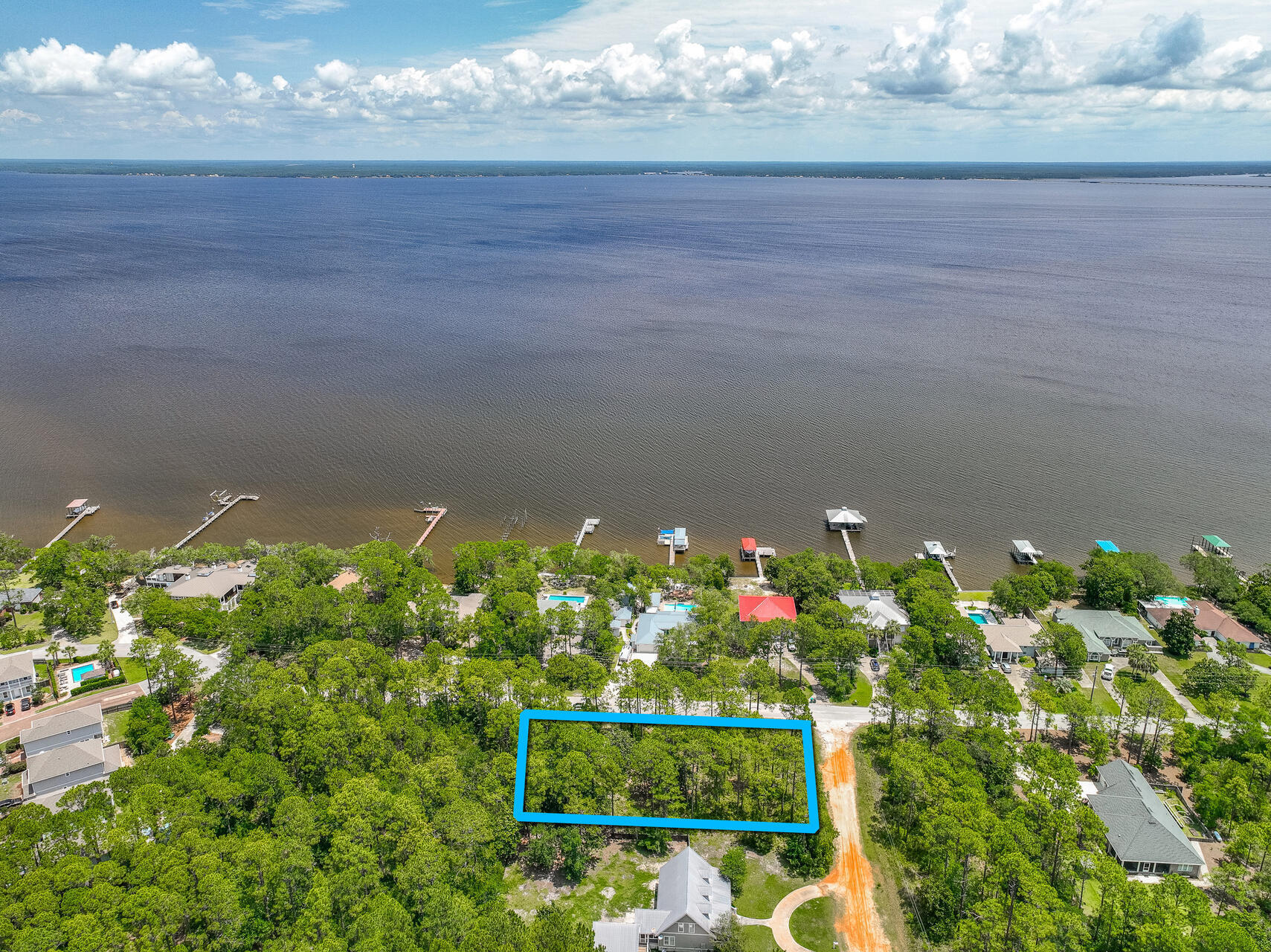 Discover the perfect opportunity to build your dream home on this spacious .51 acre lot. Located, mintues to the renowned 30A area. Imagine the convenience of being just over half a mile from the serene, bayfront, Kellogg Park, ideal for tranquil strolls and picnics by the water. For boating enthusiasts, the Cessna Landing boat launch is a mere 3 miles away, providing easy access to the stunning waters of the Gulf. Additionally, the beautiful beaches are 5 miles away, making this location a prime spot for enjoying the best of coastal living. Embrace the vibrant lifestyle and natural beauty this area offers, and create your own oasis in this sought-after community.